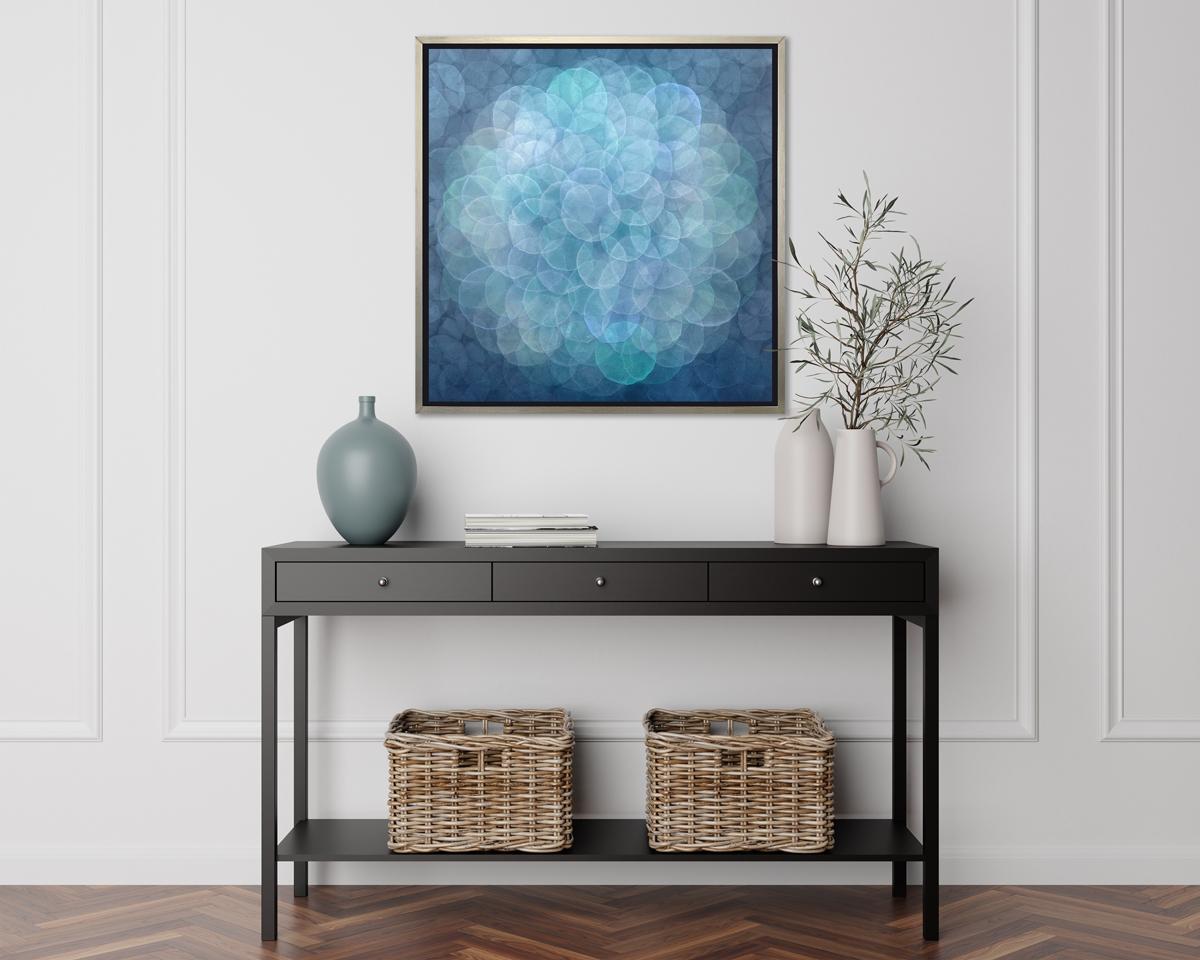 This abstract limited edition print by Roger Mudre has a cool blue, green, and silvery grey palette. It features small, overlapping circles that almost appear to glow, assembled in a larger circular pattern at the center of the composition. 

This