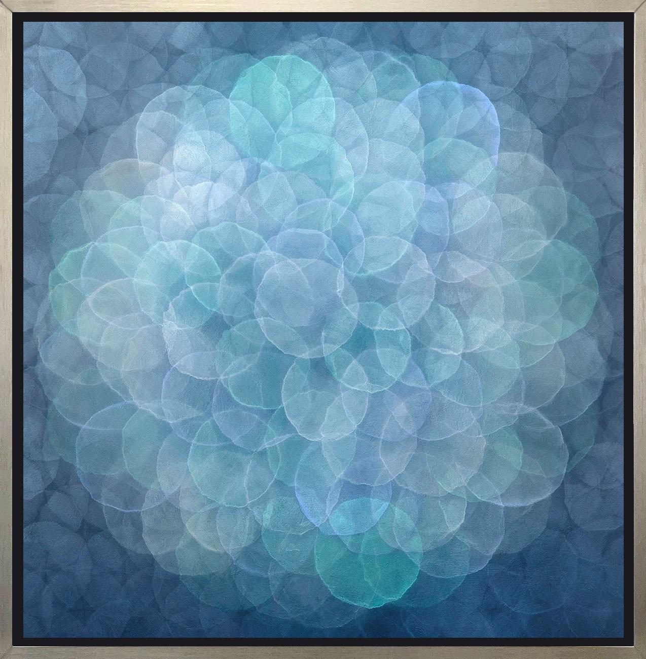 This abstract limited edition print by Roger Mudre has a cool blue, green, and silvery grey palette. It features small, overlapping circles that almost appear to glow, assembled in a larger circular pattern at the center of the composition. 

This