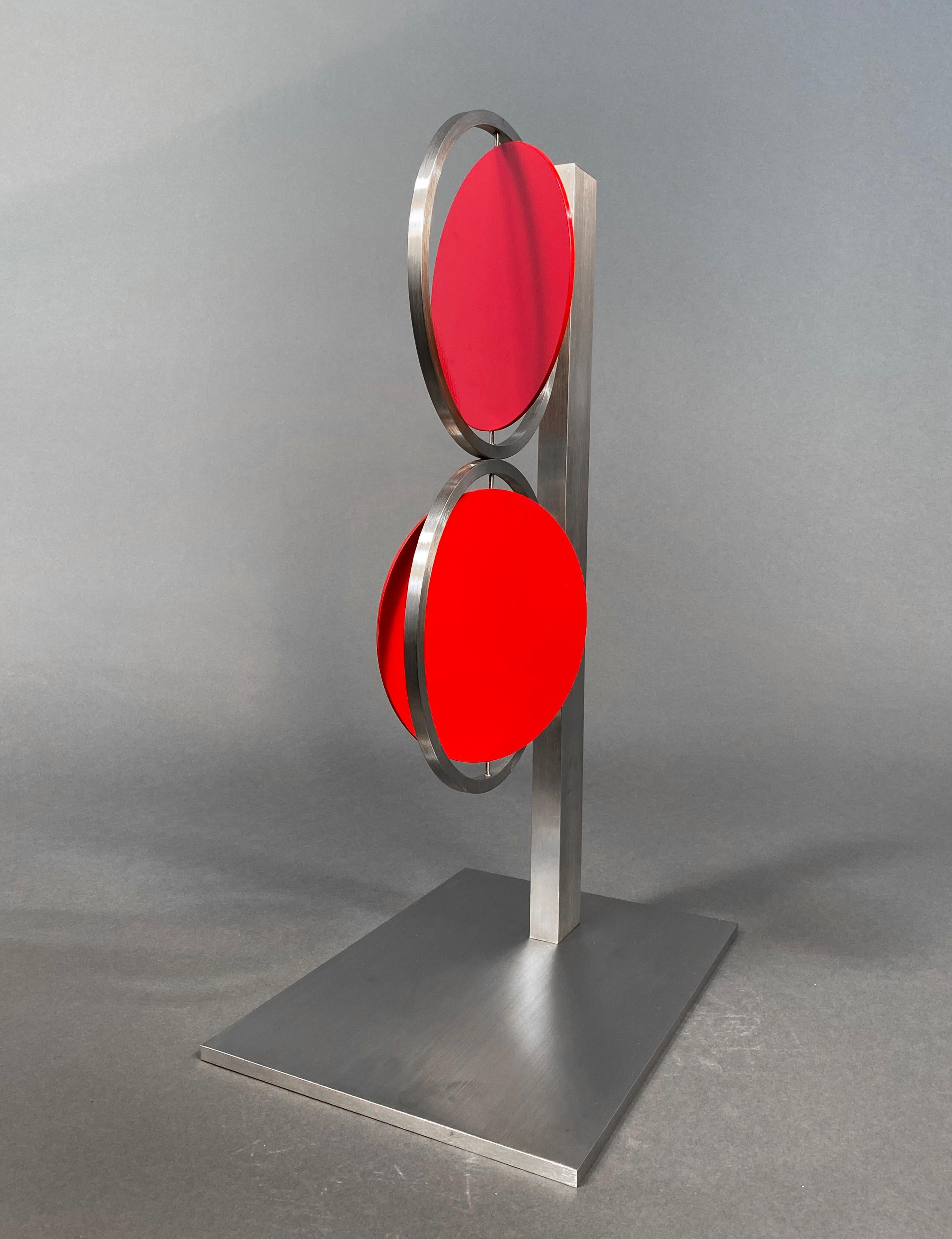 24 inch Red Figure Eight on Column - Kinetic Sculpture by Roger Phillips