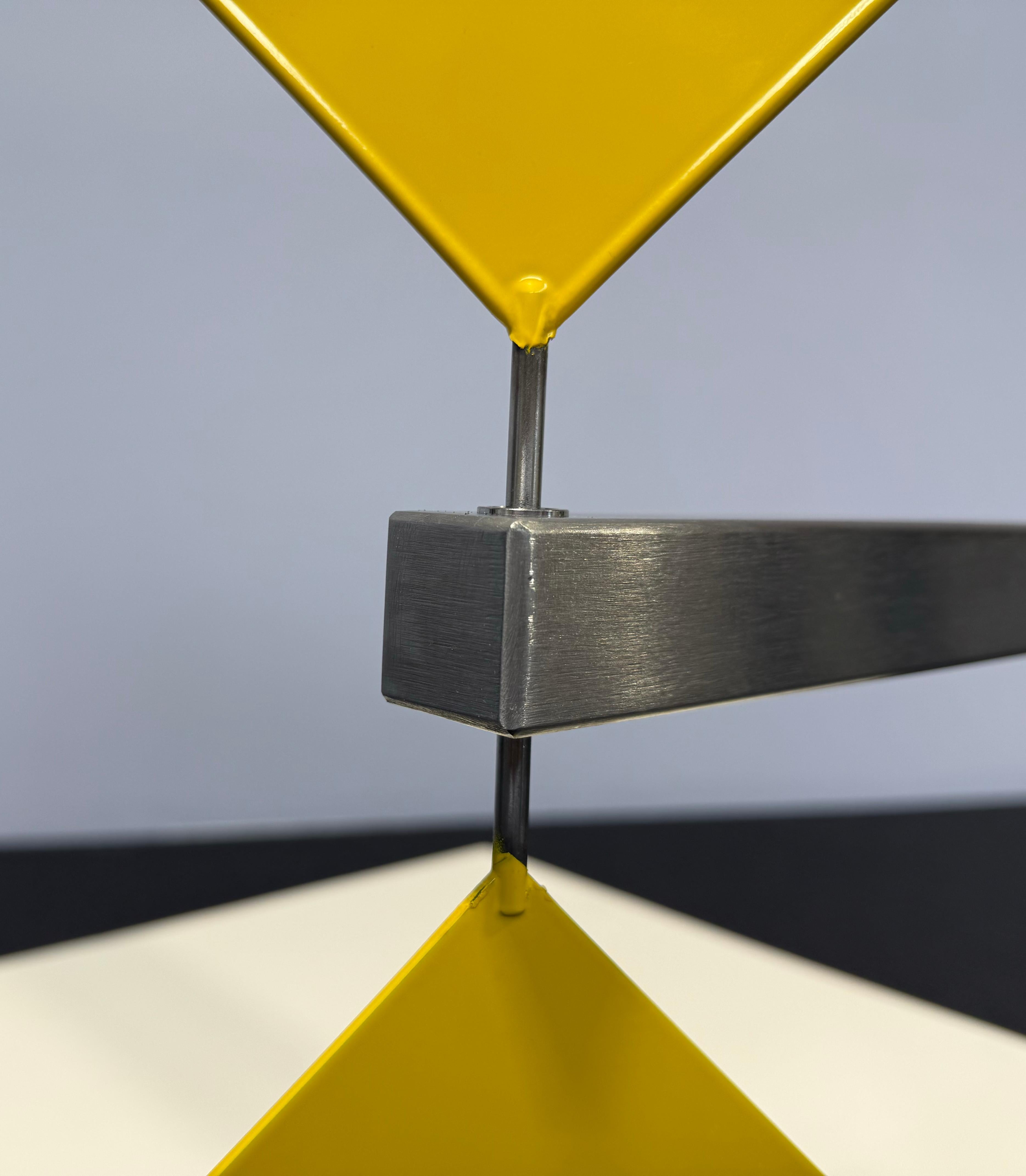 Central to Phillips's artistic ethos is the pursuit of simplicity and purity, a quest manifest in his meticulous engineering and unwavering dedication to craftsmanship. His sculptures, whether monumental installations or intimate domestic pieces,