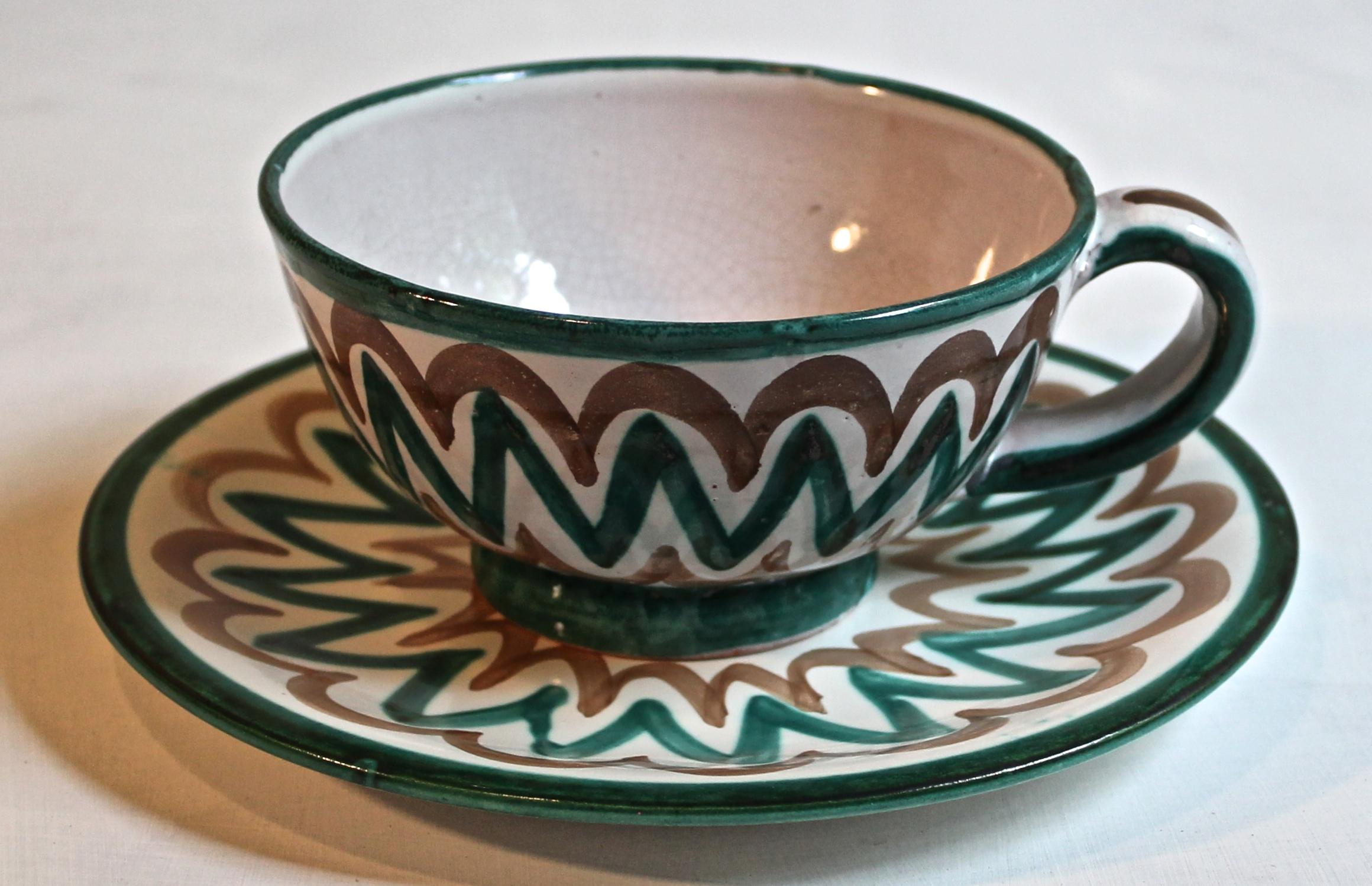 Four 'bistro' cups and saucers. Cup diameter 4 3/4