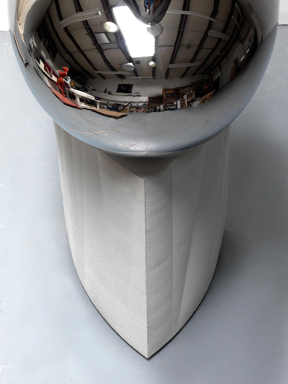 mirror polished stainless steel and fabric-form cast white cement
