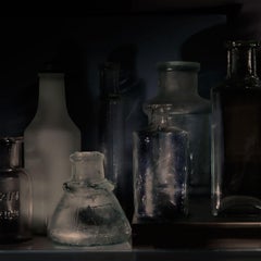 Small Bottles 24a, Still Life Photograph of Glass Bottles on Black Background