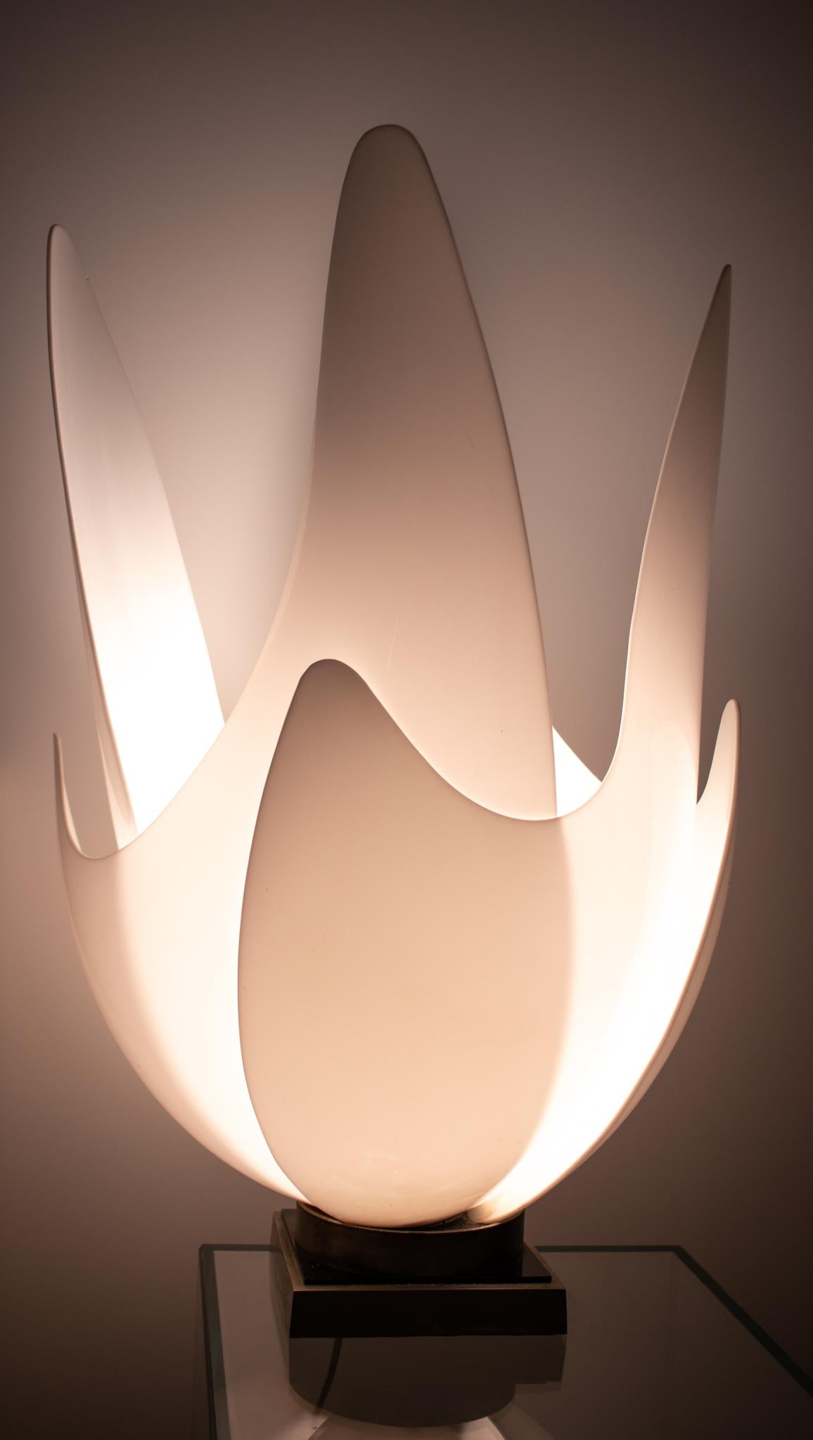 Table lamp designed by Roger Rougier (1926-1993).

A vintage sculptural modernist piece, created by the French-Canadian designer Roger Rougier, back in the 1970's. It was designed as a tall blooming tulips petals and crafted with white milky