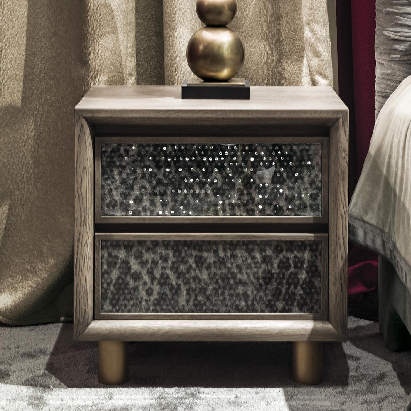 The Roger Safari nightstand is part of Chiara Provasi's Couture Collection, dedicated to the ties between the worlds of fashion, art and furnishing. In solid oak with a gray finish, the nightstand is covered in animal-print wool and adorned with