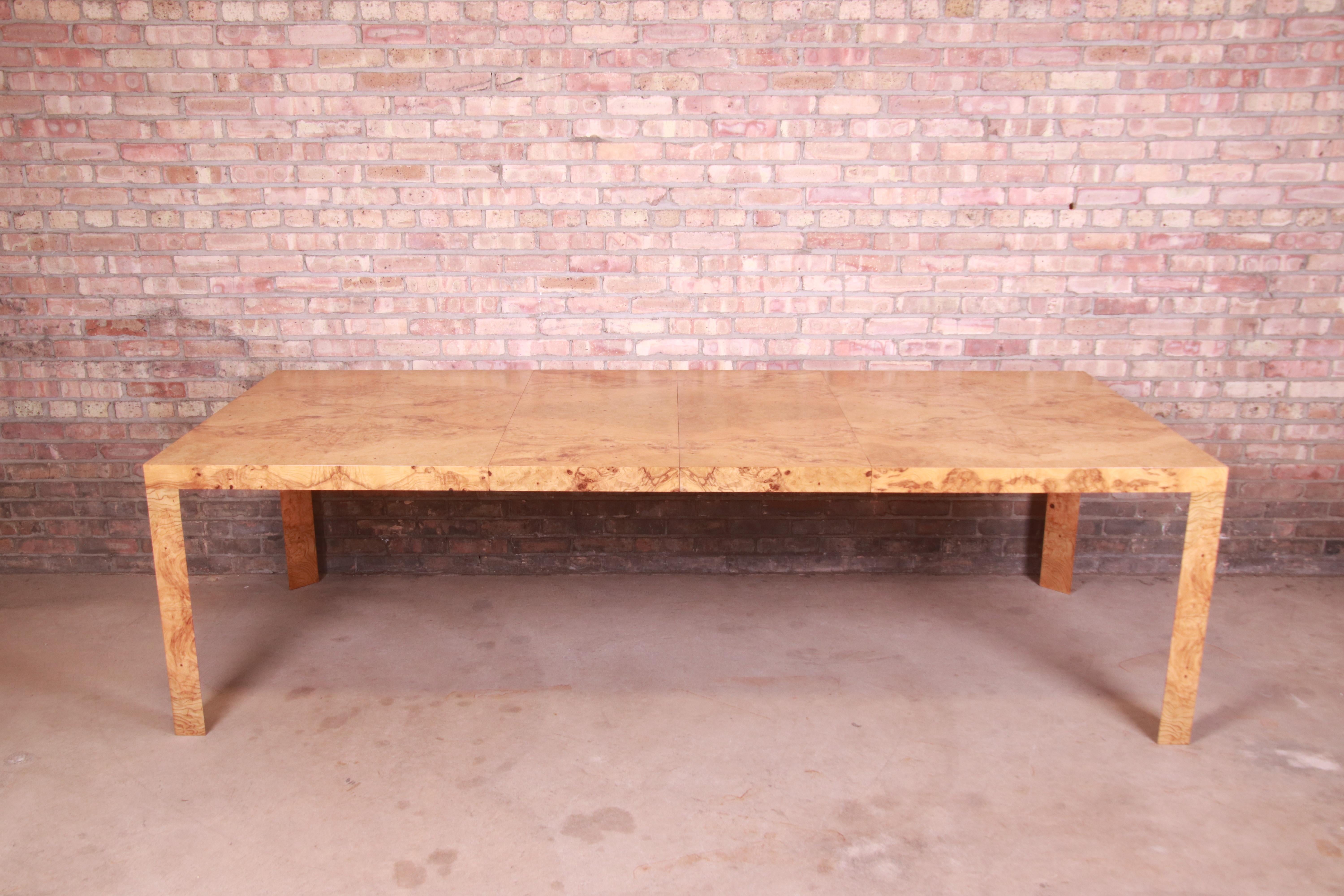 An exceptional Mid-Century Modern extension dining table

By Roger Sprunger for Dunbar Furniture

USA, 1970s

Gorgeous book-matched burled olive wood, with unique triangular legs.

Measures: 66