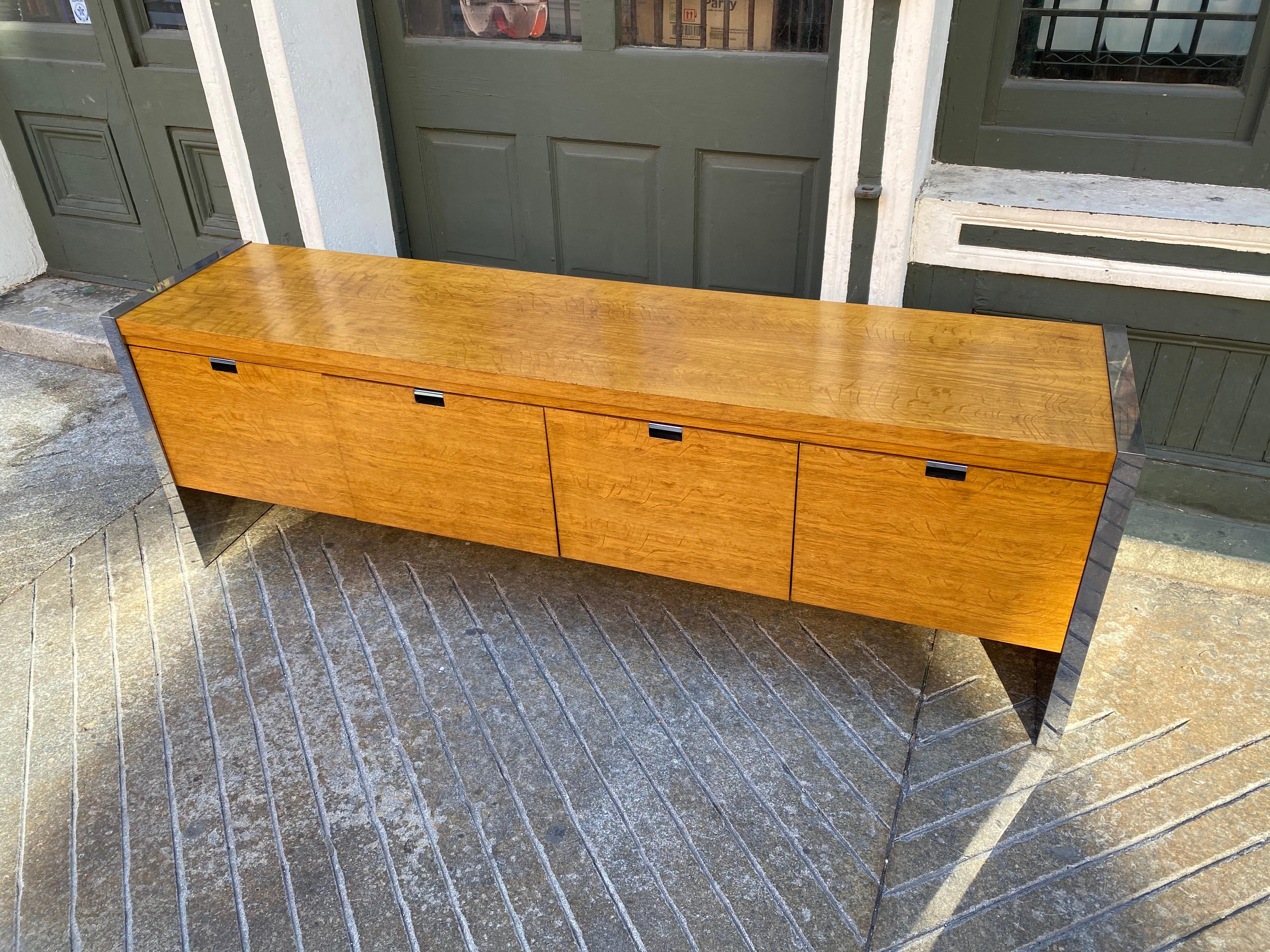 Roger Sprunger for Dunbar oak and chrome credenza. 4 pull out drawers set up for hanging files, but would work in numerous ways! People I bought from had part of it set up as a bar! In beautiful condition! Chrome ends are very clean and wood