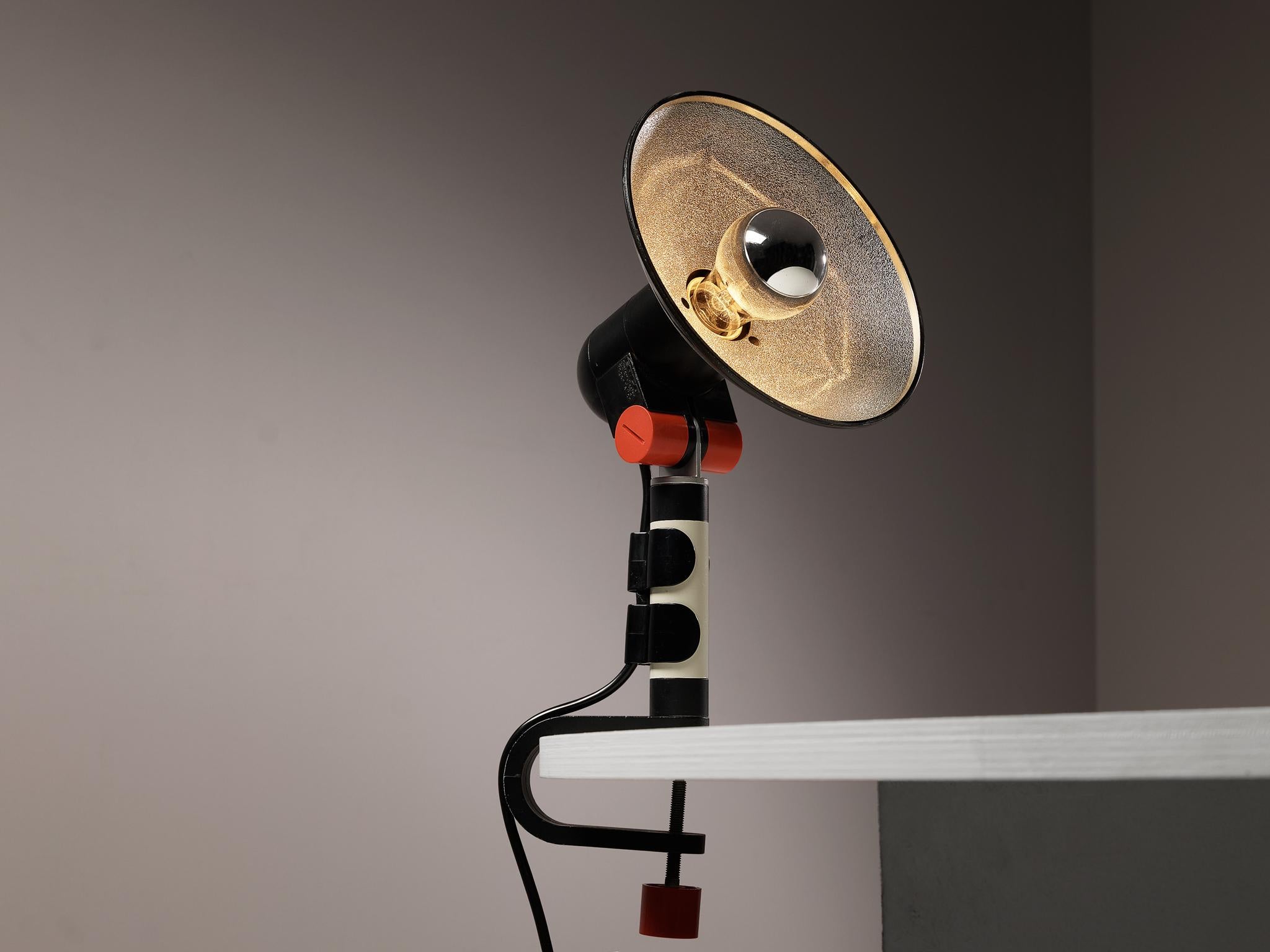 Roger Tallon for Erco, 'Spot' table lamp, plastic, aluminum, metal, France, 1972.

This table lamp is an iconic design by the French designer Roger Tallon. The black and white lamp features bright red details and can be attached to a table top. The