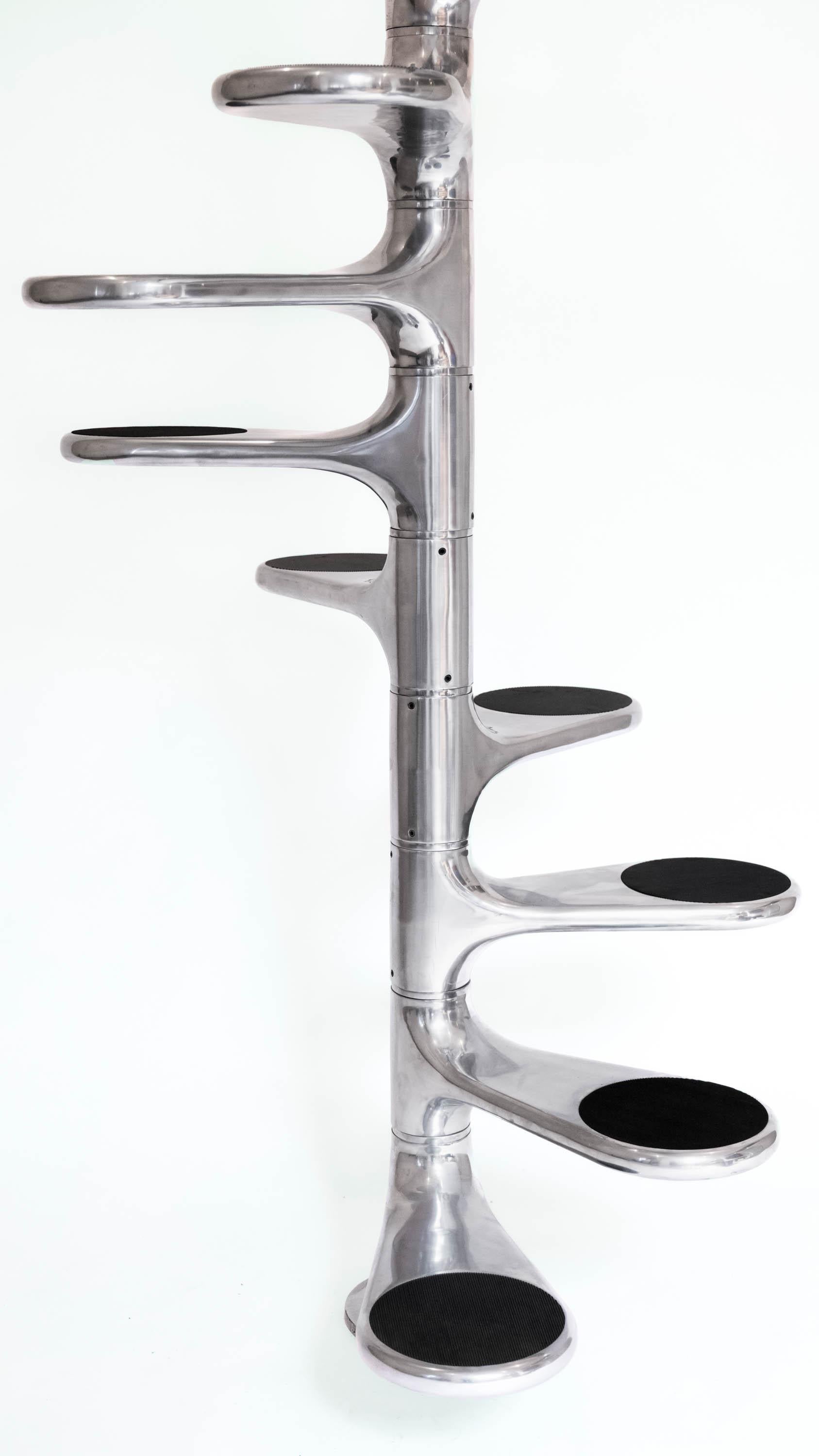 HELICOID STAIRCASE
ROGER TALLON

Helicoid staircase, also known as Escalier M400, designed by the French industrial designer Roger Tallon, produced by Sentou. 13 total steps in cast and polished aluminum with black non slip rubber on the surface.