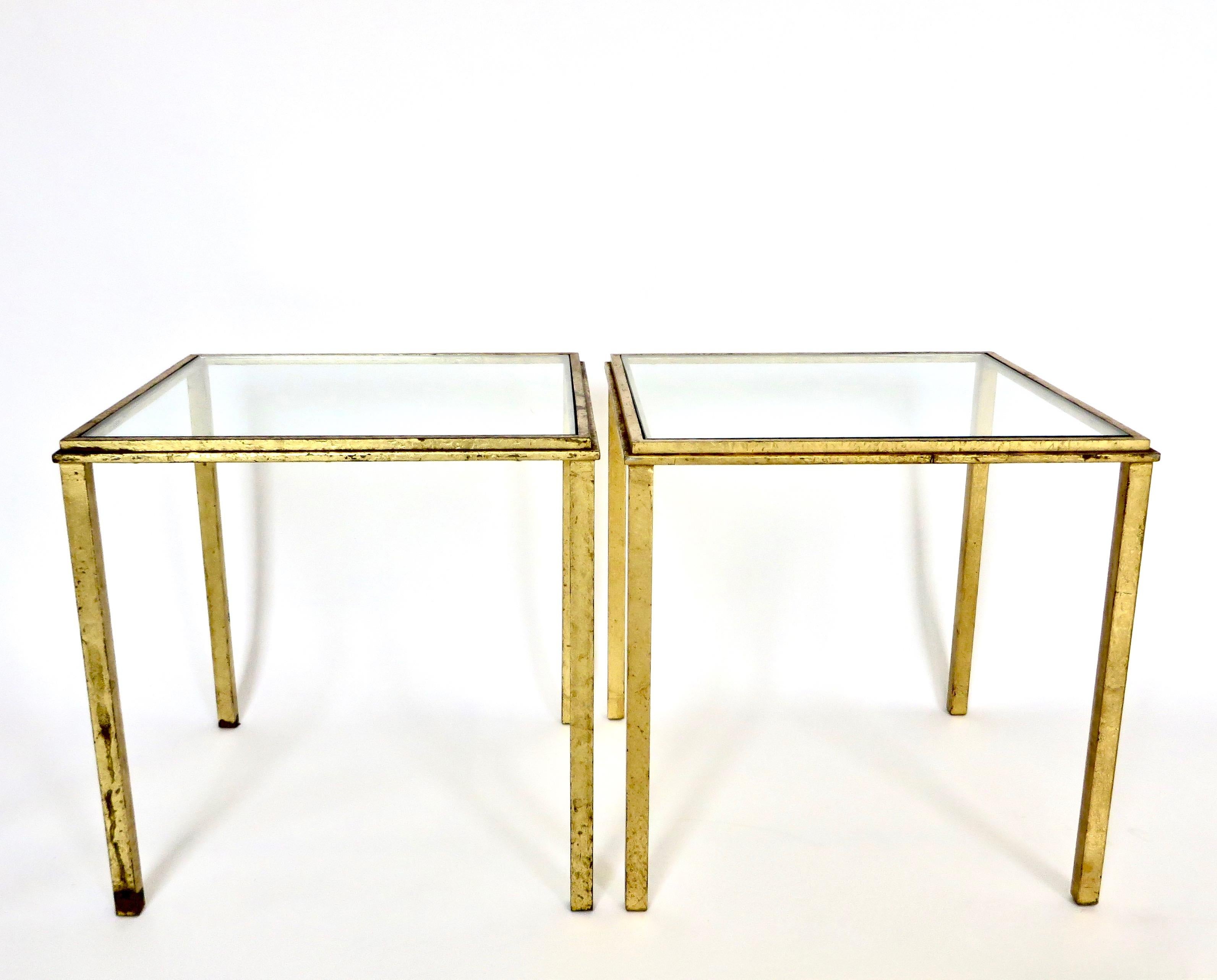 A pair of signed Roger Thibier gilded iron side tables or pair them as a small coffee table.
Patina as shown. Patina can be restored upon request.
Stamped R Thibier.