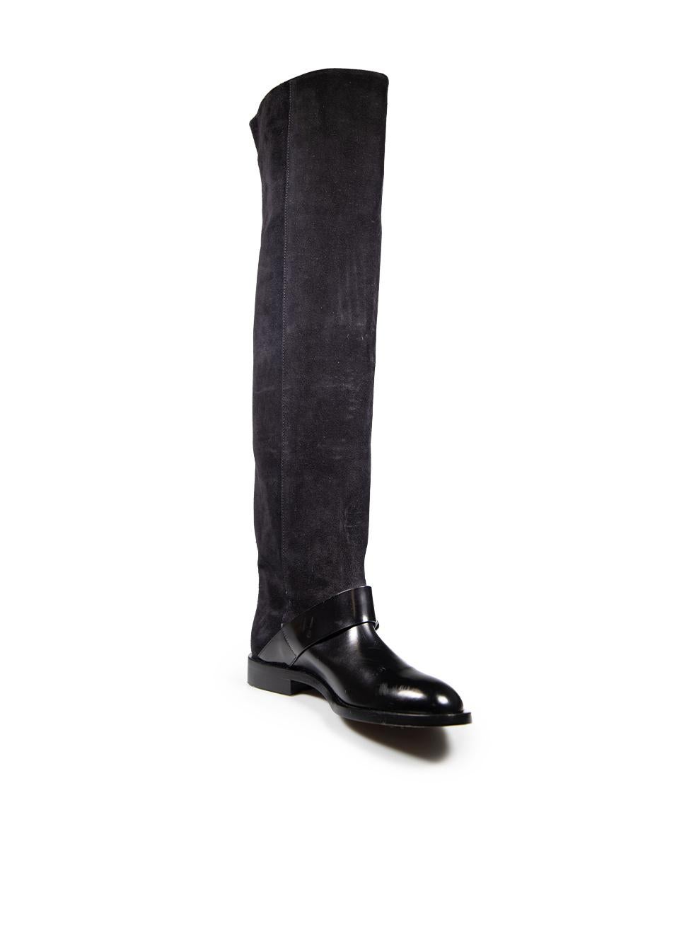 CONDITION is Very good. Minimal wear to the boots is evident. There are small scratches and marks on the front toe box, the front strap buckle detail and the shaft. The rear and the top edge of the right shaft have discolouration and there is minor