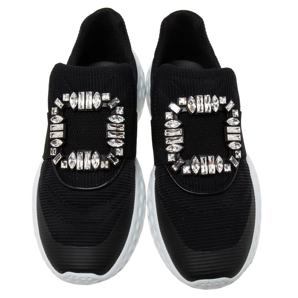 Look your stylish best every time you step out wearing these Viv Run Light sneakers from the House of Roger Vivier. They are made from black nylon on the exterior with a crystal-embellished motif perched on their vamps. They are made in a slip-on