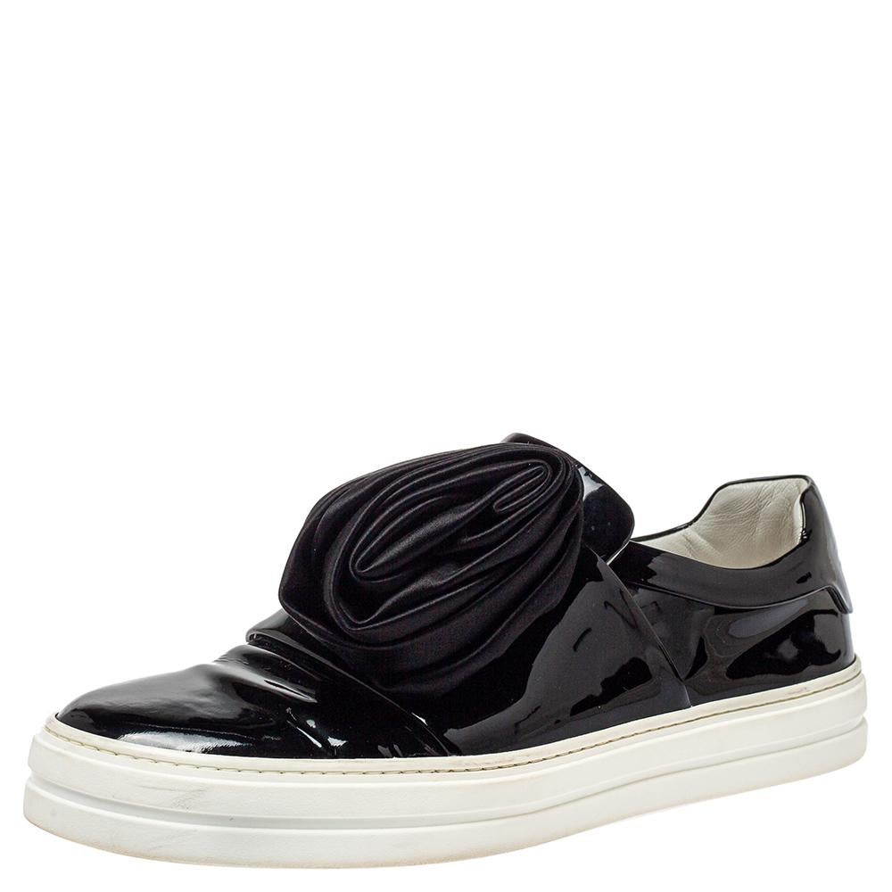 Flaunt your love for fashion by wearing these slip-on sneakers from Roger Vivier. They are expertly crafted from patent leather and feature pleated satin details on the vamps, comfortable leather insoles, and thick rubber soles. Grab these black