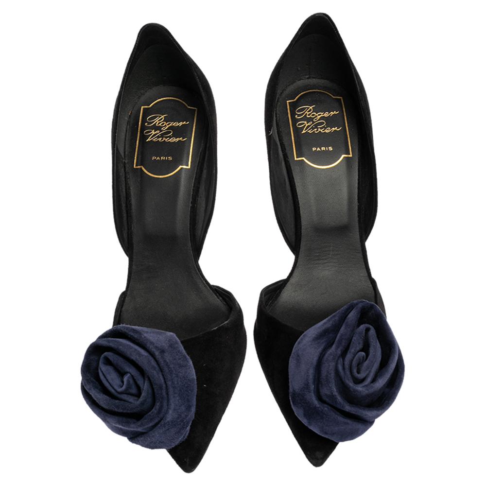 These pumps by Roger Vivier are stylish and perfect for special evenings. Crafted from suede, they come in a classic shade of black and will complement a host of outfits. They are styled with pointed toes, rose detailing on the uppers, and 10.5 cm