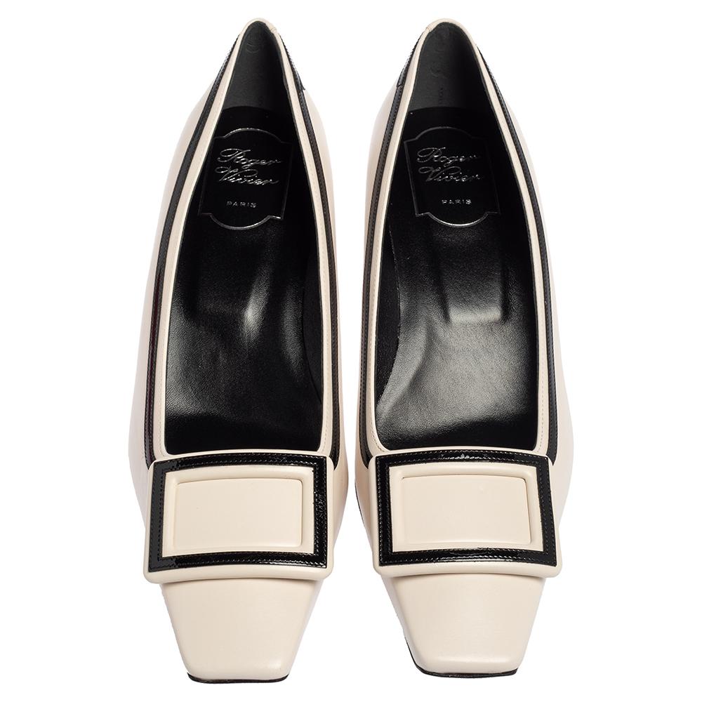 Beautifully blending fashion and comfort, these Belle pumps from Roger Vivier are one of a kind! They are crafted from white & black patent leather & leather and styled with square toes and rectangular accents on the uppers. They are complete with