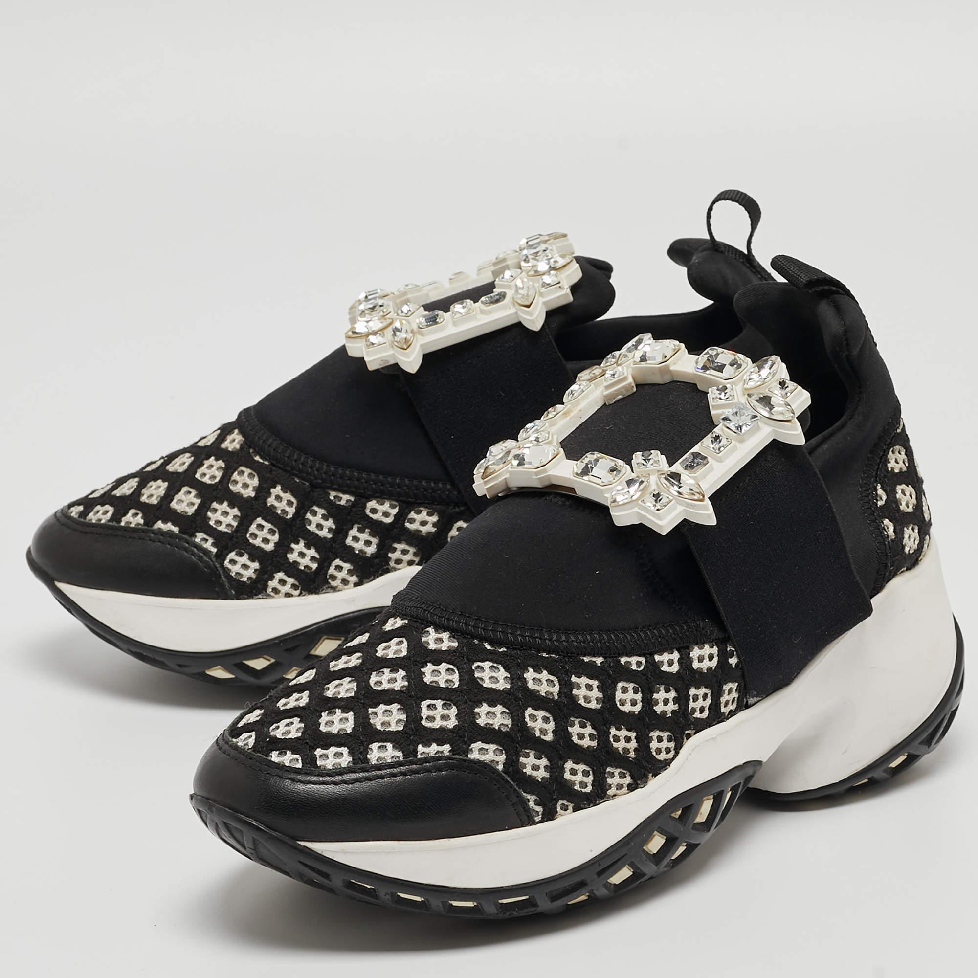 Look your stylish best every time you step out wearing these Sneaky Viv sneakers from the House of Roger Vivier. They are made from mesh and neoprene on the exterior with a crystal-embellished motif perched on their vamps. They are made in a slip-on