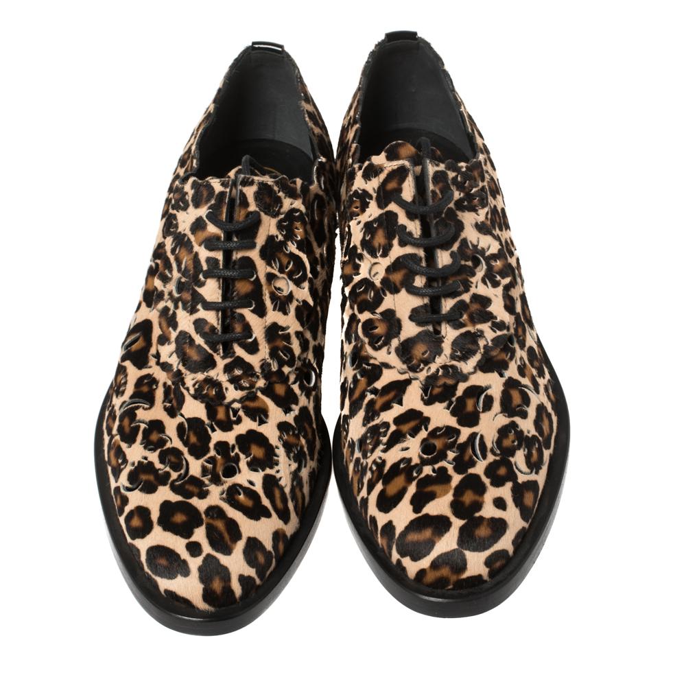 These designer derby shoes from the house of Roger Vivier are just what you need to nail a statement look. These brown shoes are crafted from animal-printed calf hair and finished with laser-cut detailing, lace-ups on the uppers, and sturdy