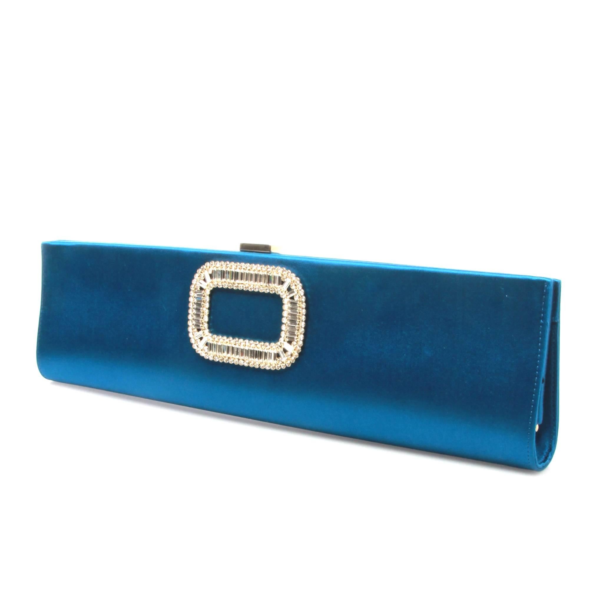 Blue satin Roger Vivier clutch with silver-tone hardware, crystal embellishments at front, tonal satin interior lining and push-lock closure at top. 