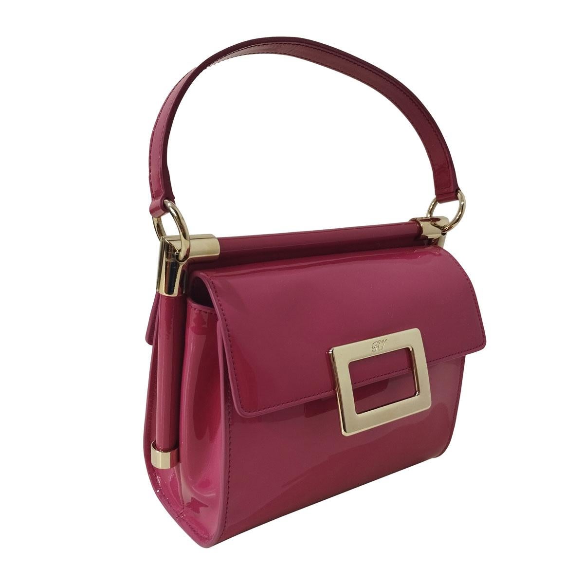 Patent leather
Fuchsia color
Can be carried by hand or crossbody
Golden metal
Double internal compartment 
Orange leather internal
Internal pocket
Cm 19 x 16 x 9 (7,4 x 6,29 x 3,54 inches)
Little sign as seen in picture
Express shipping included in