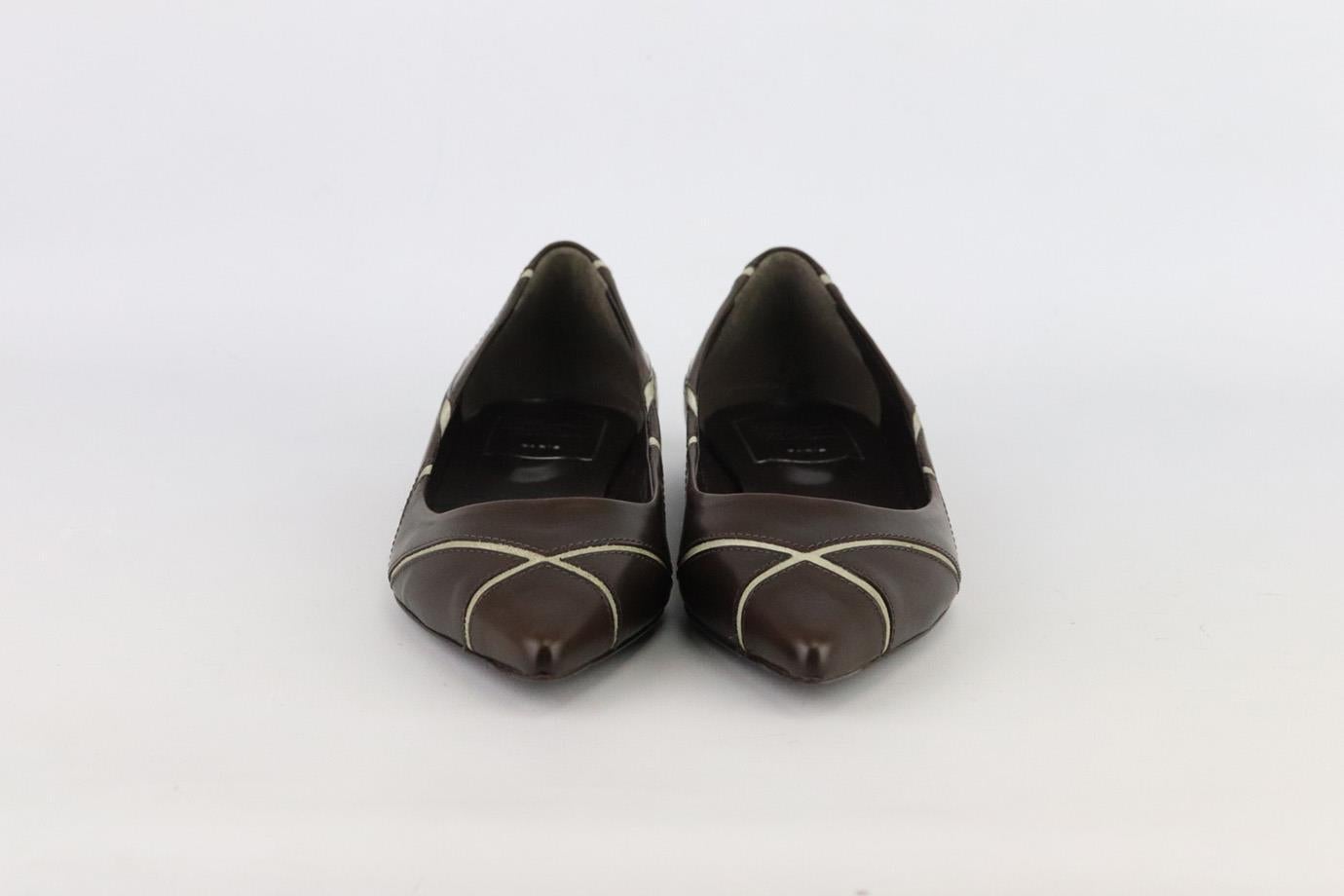 These ballerina flats by Roger Vivier have been crafted in Italy from smooth brown leather and grey suede in a geometric design and have sharp pointed toe. Rubber sole measures approximately 19 mm/ 0.75 inchs. Brown leathe,r grey suede. Slips on.