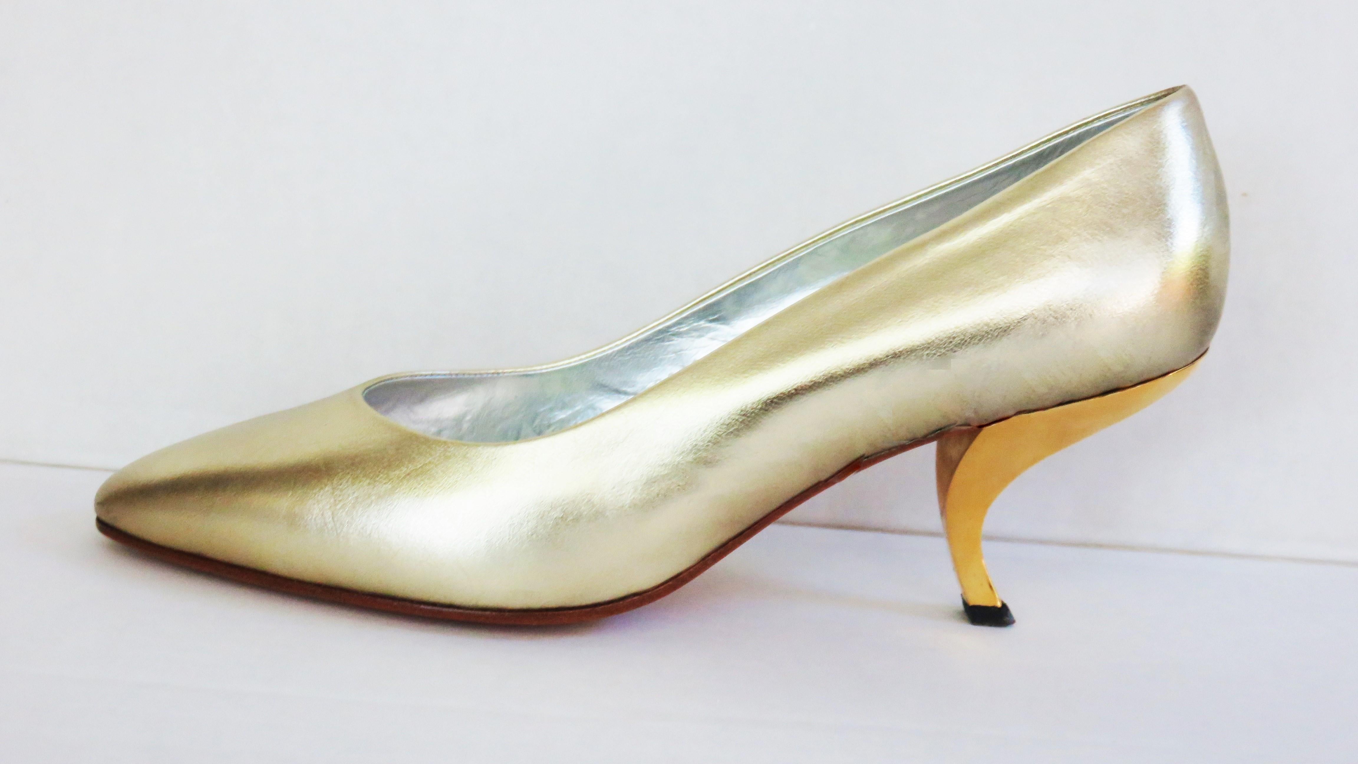 Gorgeous soft gold leather original comma heel pumps by Roger Vivier. They have leather uppers and soles and are lined in silver leather.  
Marked US size 8 (but run smaller). Small scuff on left shoe front.

Insole Length  9 7/8