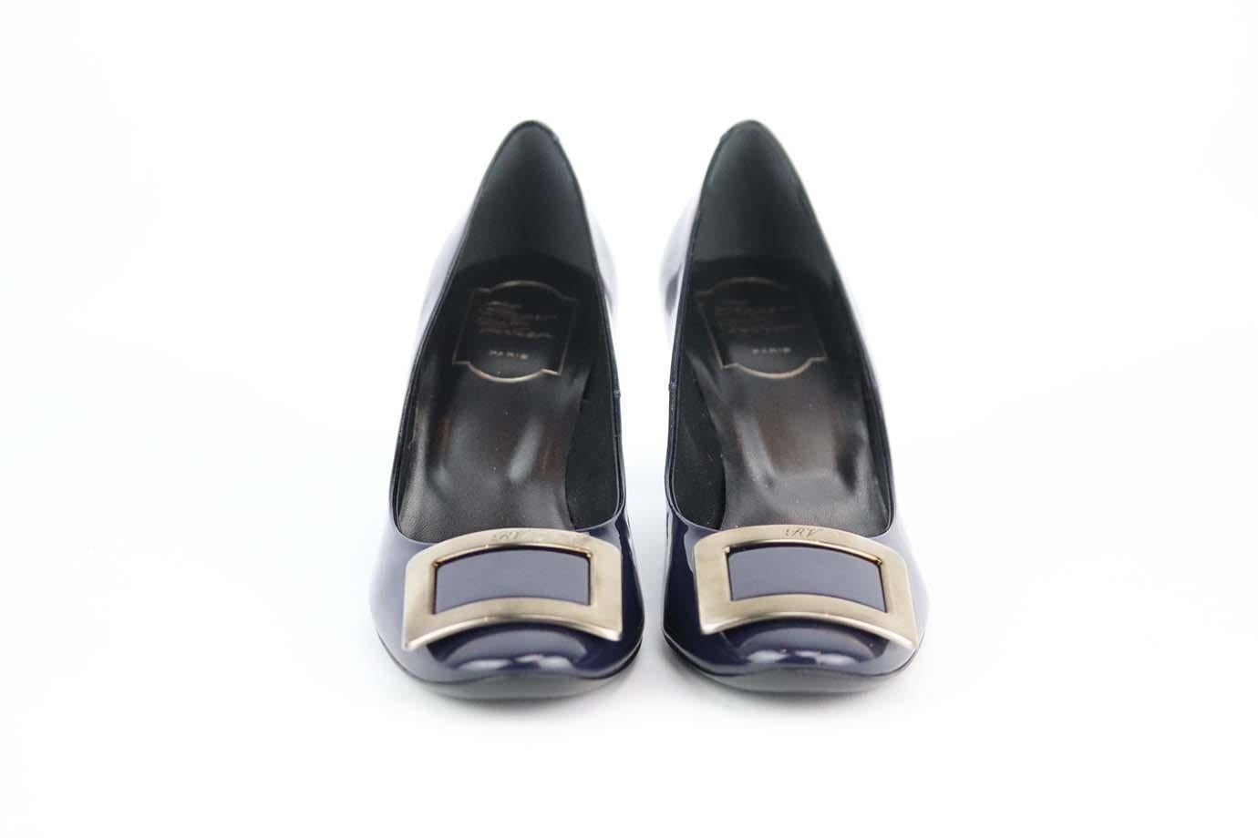 These pumps by Roger Vivier are an elegant re-creation of the founder's original 1965 design, they're made from navy patent-leather and embellished with a silver-tone signature buckle that tops the rounded toe. Heel measures approximately 50 mm/ 2