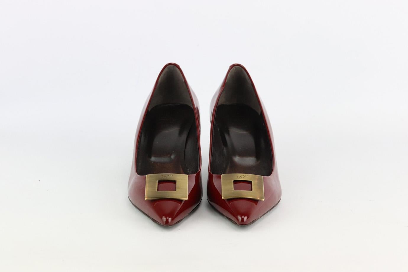 These pumps by Roger Vivier are an elegant re-creation of the founder's original 1965 design, they're made from burgundy patent-leather and embellished with a bronze-tone signature buckle that tops the sharp pointed toe. Heel measures approximately