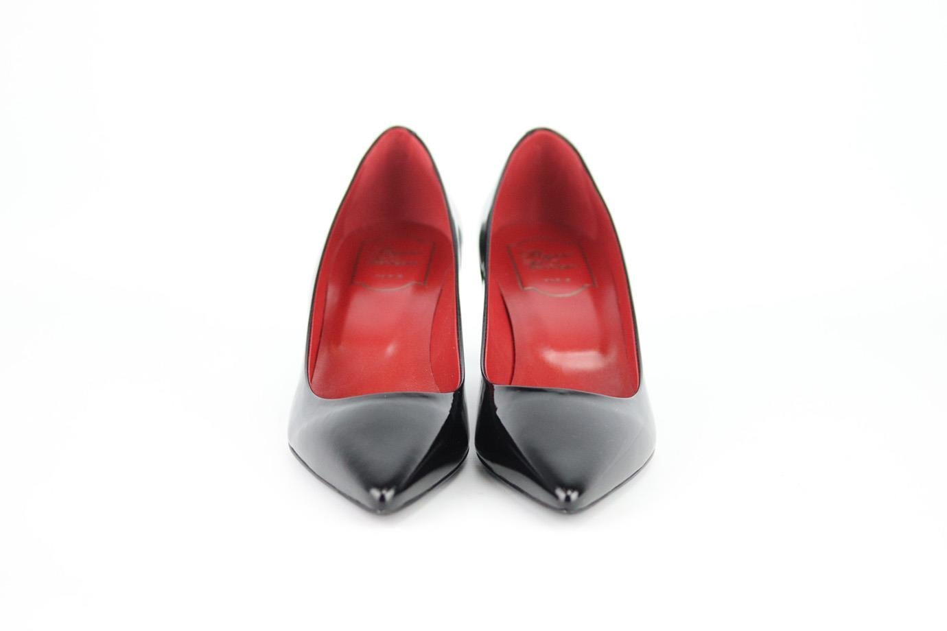 These pumps by Roger Vivier are a classic style that will never date, made in Italy from black patent-leather with red interior leather, they have sharp pointed toes and comfortable 38 mm heels to take you from morning meetings to dinner with