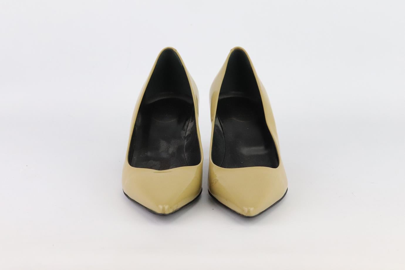 These pumps by Roger Vivier are a classic style that will never date, made in Italy from beige patent-leather, they have sharp pointed toes and comfortable 38 mm heels to take you from morning meetings to dinner with friends. Heel measures