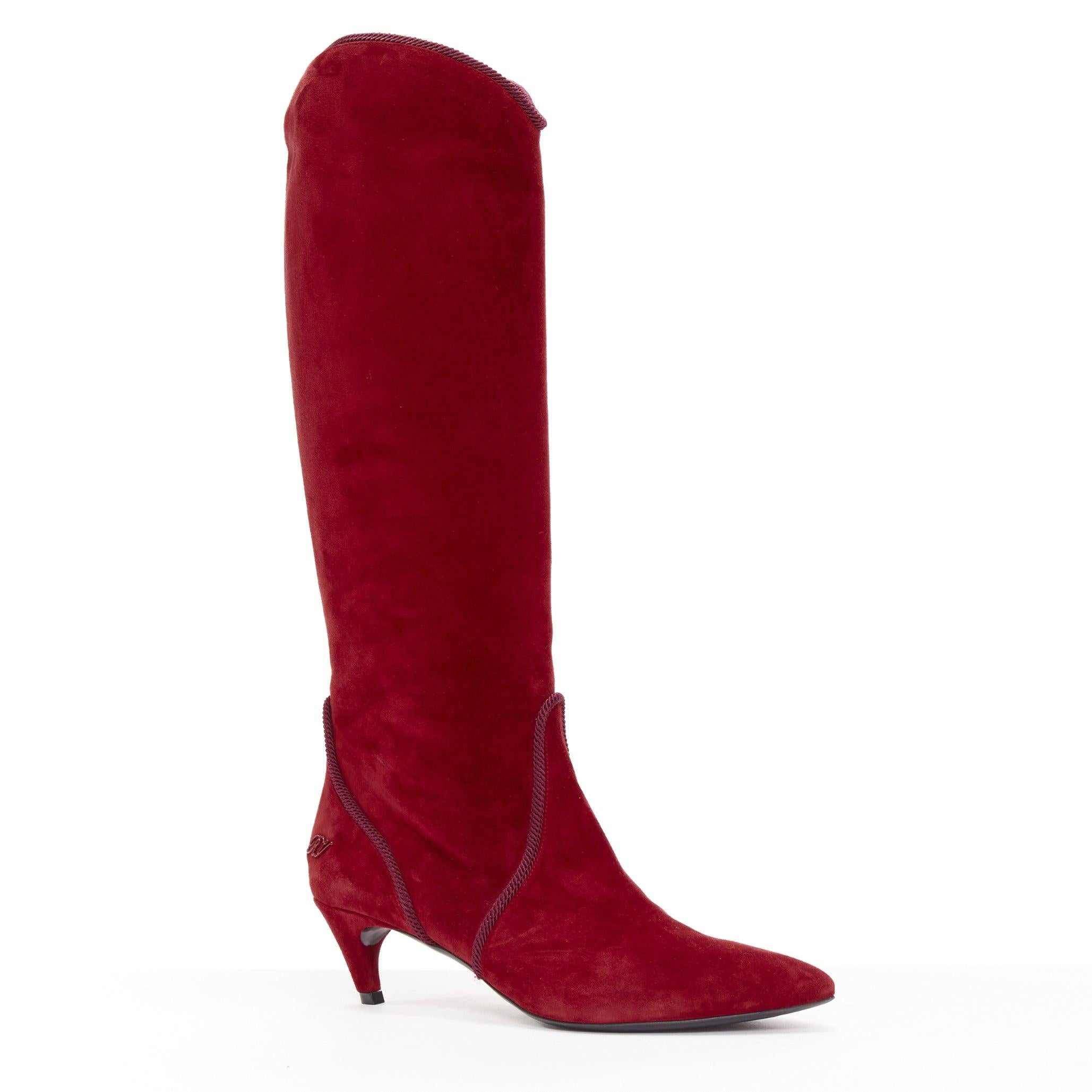 ROGER VIVIER red suede purple piping RV charm kitten heel cowboy boot EU37.5
Reference: NKLL/A00093
Brand: Roger Vivier
Material: Suede
Color: Red, Purple
Pattern: Solid
Closure: Pull On
Extra Details: Red suede with purple braid piping detail.