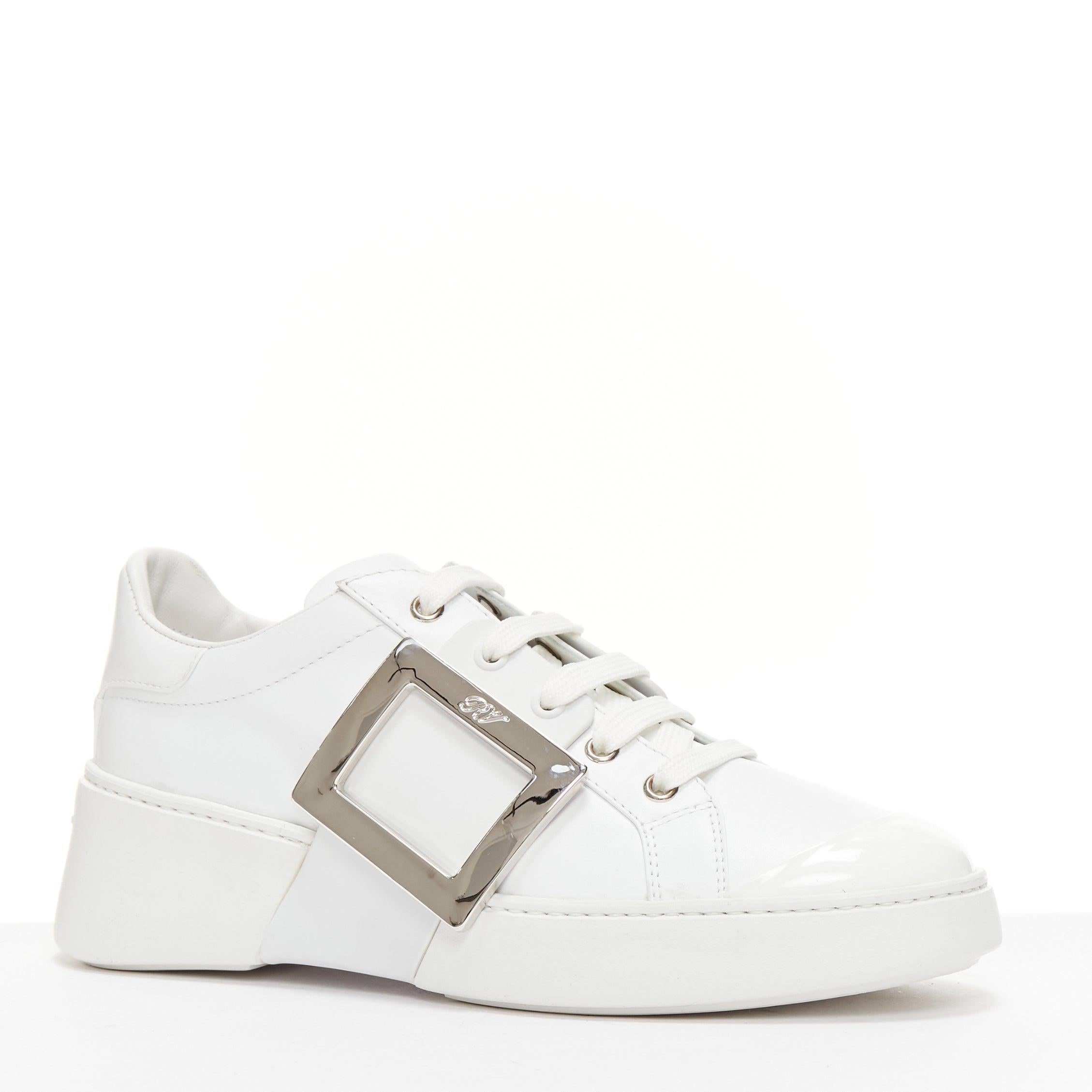 ROGER VIVIER Viv Skate white patent silver RV buckle sneakers EU38.5
Reference: AAWC/A01167
Brand: Roger Vivier
Model: Viv Skate
Material: Leather, Patent Leather
Color: White, Silver
Pattern: Solid
Closure: Lace Up
Lining: White Leather
Extra