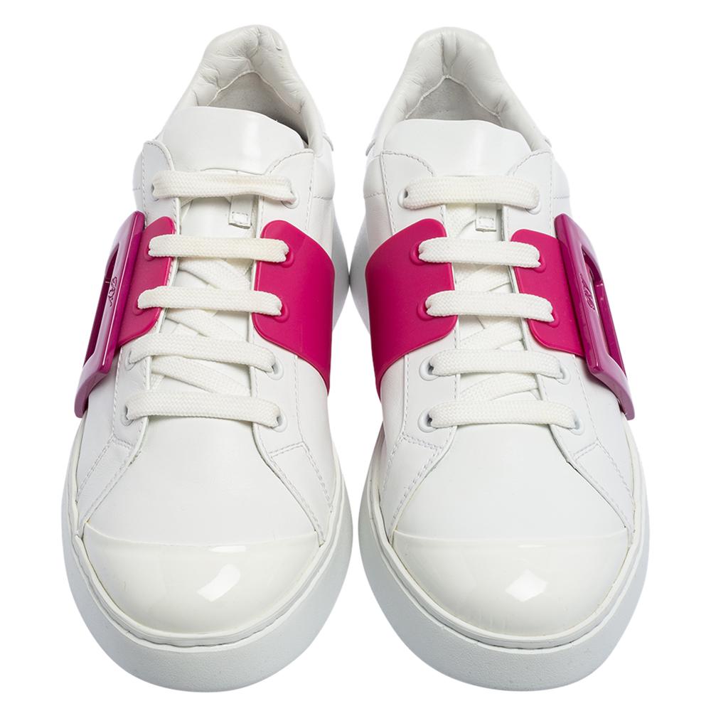 Look your stylish best every time you step out wearing these Roger Vivier sneakers. Crafted in Italy, they are made from quality leather and come in white. Aimed to deliver high style, the pair is embellished with a contrasting pink buckle on the