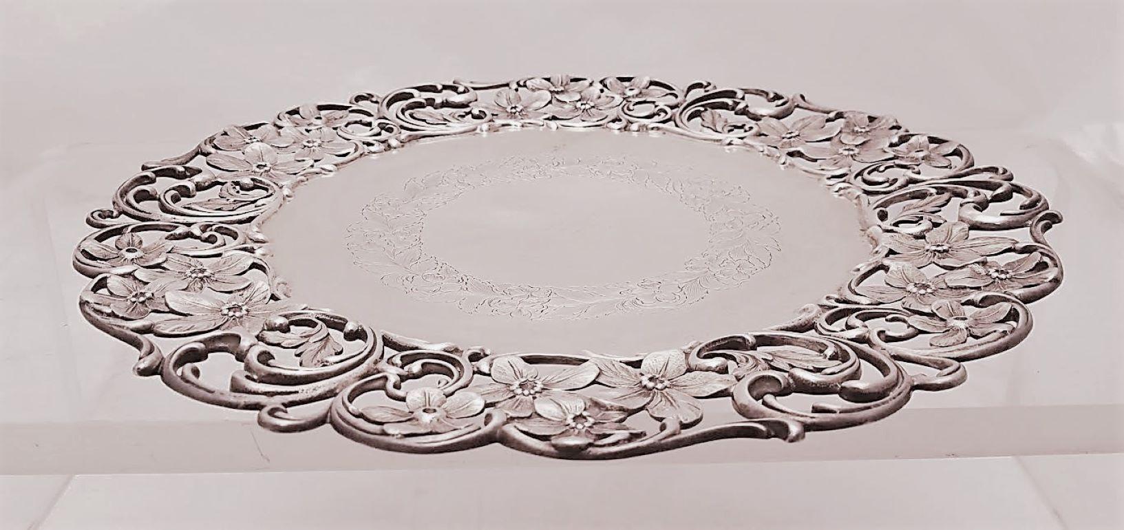 Stunning Roger Williams Silver Co. sterling silver plate / dish with intricate floral and swirl designs on the rim. Floral and leaf engravings on the center on the plate, standing on a small pedestal. A great gift and addition to one's collection or