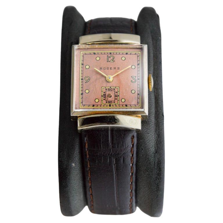 FACTORY / HOUSE: Rogers Watch Company
STYLE / REFERENCE: Art Deco / Tank Style
METAL / MATERIAL: Yellow Gold Filled
CIRCA / YEAR: 1940's / 50's
DIMENSIONS / SIZE: 30mm Length X 23mm Width
MOVEMENT / CALIBER: Manual Winding / 17 Jewels  
DIAL /