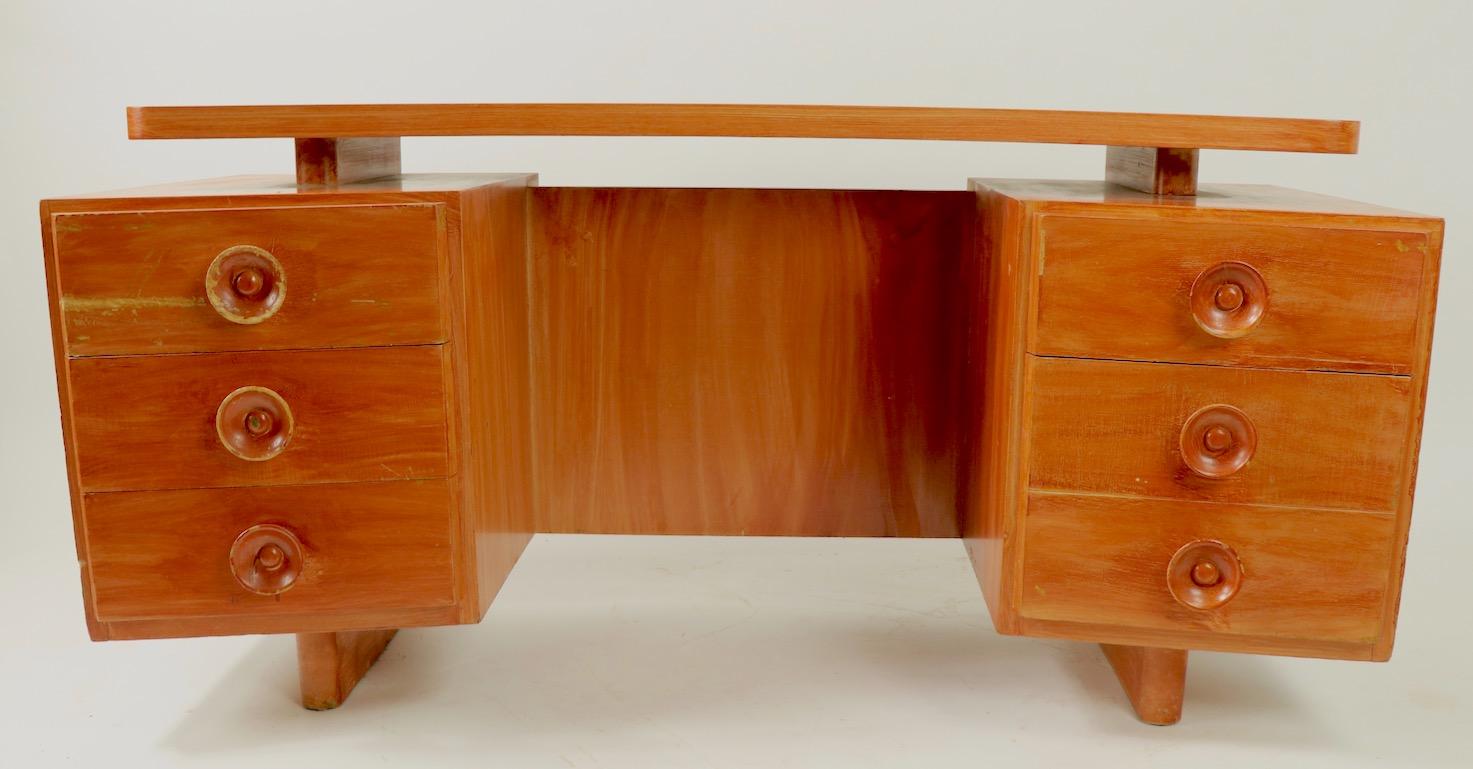 Classic Gilbert design for Herman Miller Art Deco vanity. This interesting vanity has a floating freeform top surface over two banks of drawers. The vanity is selling as is, it has been painted, and will need to be refinished and restored.
 