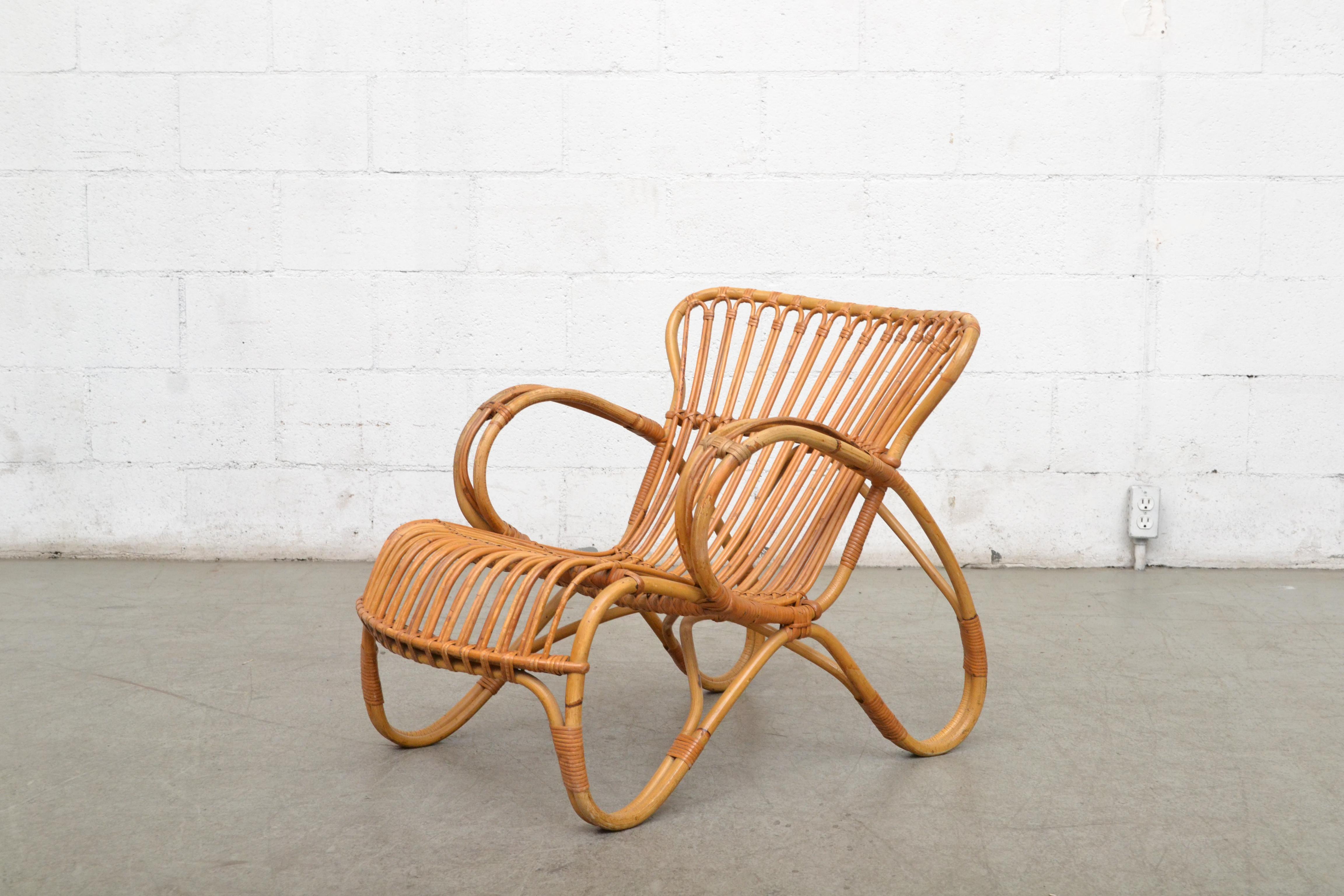 Low back bamboo lounge chair in good original condition with wear consistent with its age and use. Other similar chairs available and listed separately.