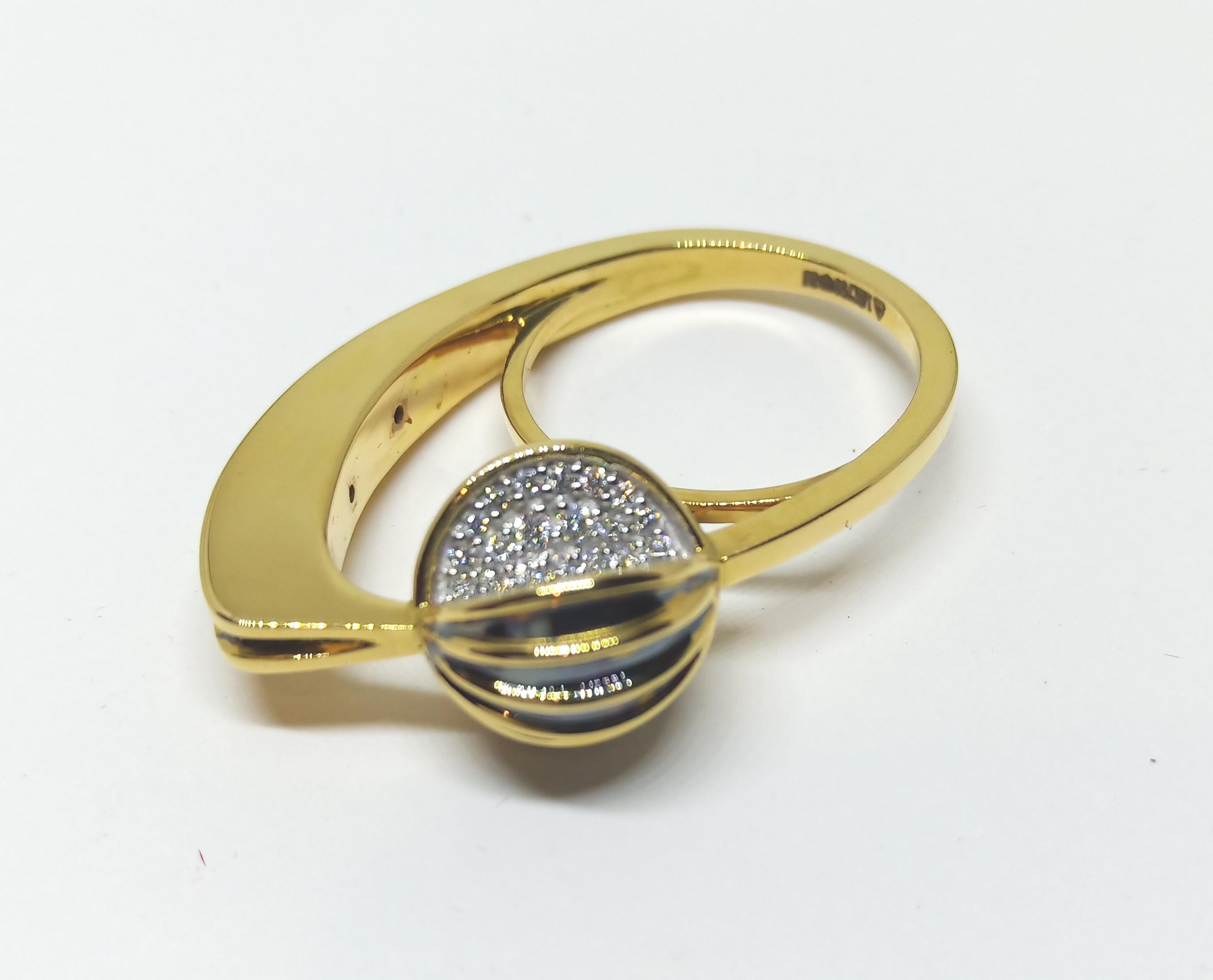 This One Of A Kind Ring features Round White Diamonds in Yellow Gold with accents of Black Rhodium. Rohit infuses unique design elements to create this special work. 
- Round White Diamonds (Total Carat Weight: 0.21 carats)
-18 Karat Yellow Gold (