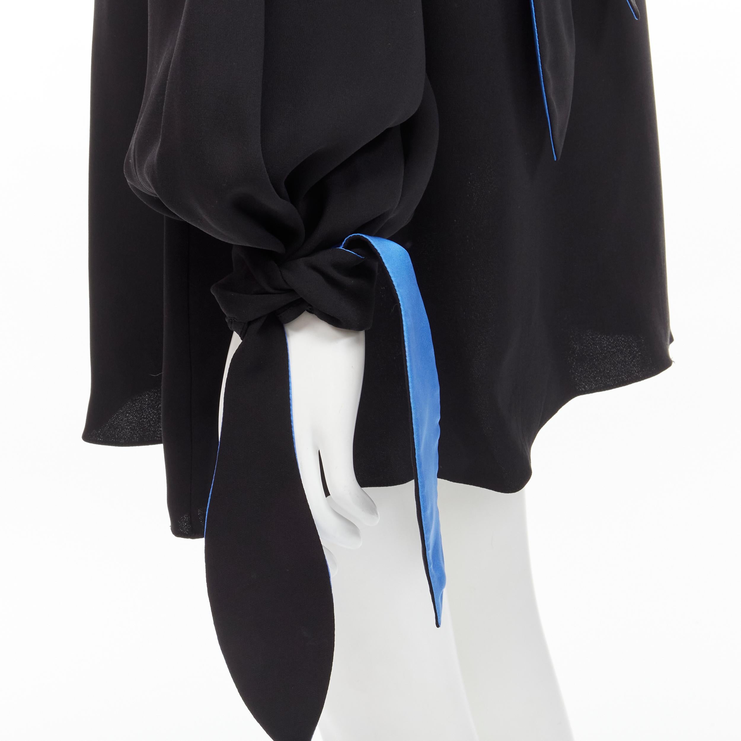 ROKSANDA 100% silk black blue bow tie cuff tunic dress UK8 S 
Reference: JACG/A00020 
Brand: Roksanda 
Material: Silk 
Color: Black 
Pattern: Solid 
Closure: Tie 
Extra Detail: Keyhole back. Self tie at back of neck and at cuff. 
Made in: England