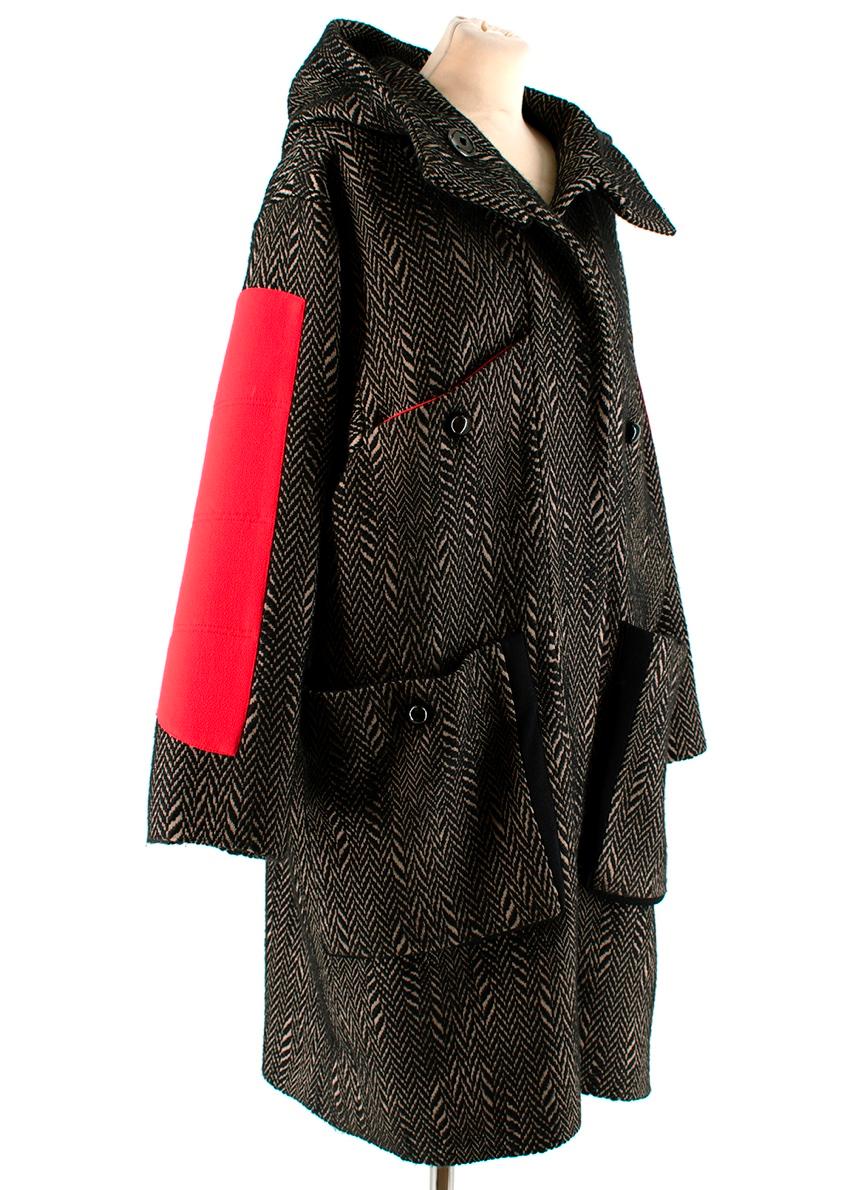 Roksanda Ilincic Black & Brown Chevron Hooded Coat

-Beautiful chevron pattern 
-Red crepe details to the arms and neck  
-Luxurious silk lining 
-4 outer pockets 
-Pressure button fastening to the front 

Dry cleaning only 

Made in England