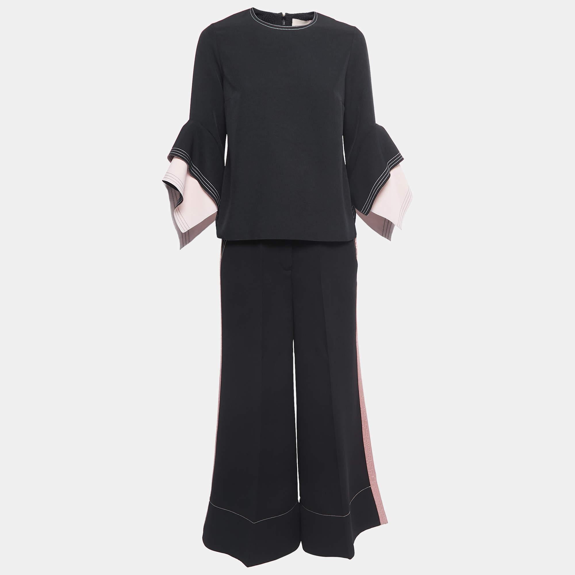 Characterized by impeccable tailoring, a good fit, and the use of quality materials, this pant and top set will help you serve chic looks. Style it with heels or boots to bring out the stylish appeal of the creation.

