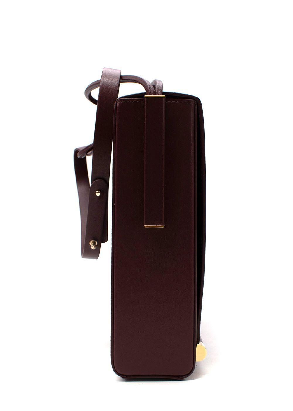Roksanda Burgundy Leather Flat Box Bag

- Sturdy rectangular shape with unusual double strap feature
- Long front flap with gold-tone metal hardware
- Opens to a navy leather-lined interior

Material:
Leather

Made in Italy

PLEASE NOTE, THESE ITEMS