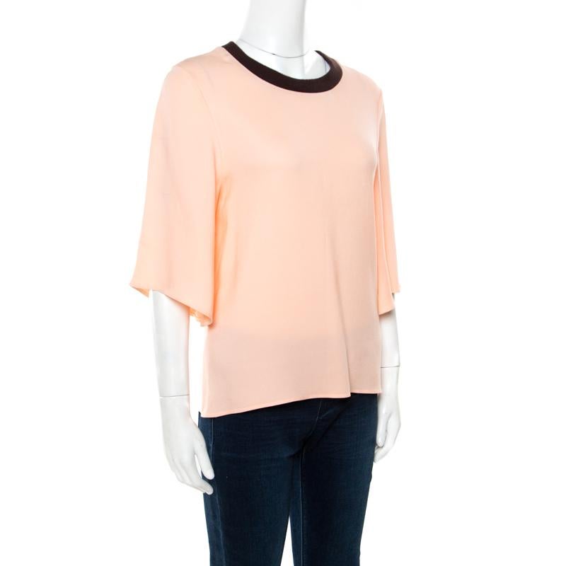 Simple and stylish, this Roksanda Ilincic top is an ideal buy. It has been tailored from quality fabrics and designed with a ribbed neckline and flared sleeves. This peach top can be worn with pants as well as skirts.

Includes: The Luxury Closet