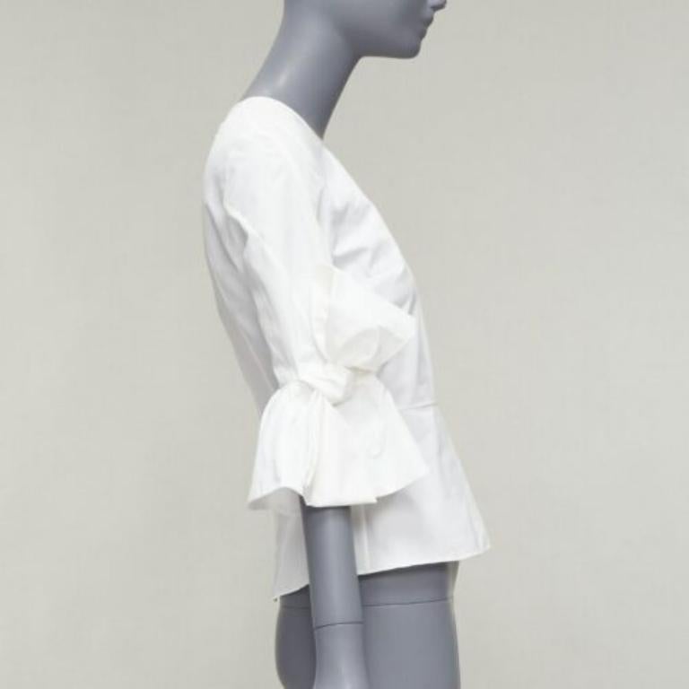 ROKSANDA Kemi white cotton poplin bow cuff flared sleeve peplum top UK6 XS In Excellent Condition For Sale In Hong Kong, NT