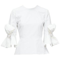 ROKSANDA Kemi top peplum blanco de popelina de algodón con puño de lazo y manga acampanada UK6 XS