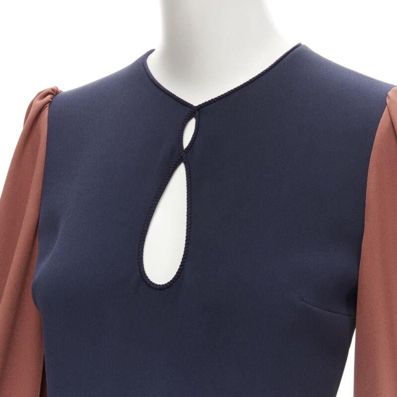 ROKSANDA navy brick red puff sleeve keyhole neckline wide leg jumpsuit UK6 XS
Reference: AAWC/A00119
Brand: Roksanda
Material: Polyester, Blend
Color: Navy, Red
Pattern: Solid
Closure: Zip
Lining:  Silk
Extra Details: Keyhole embroidery piping