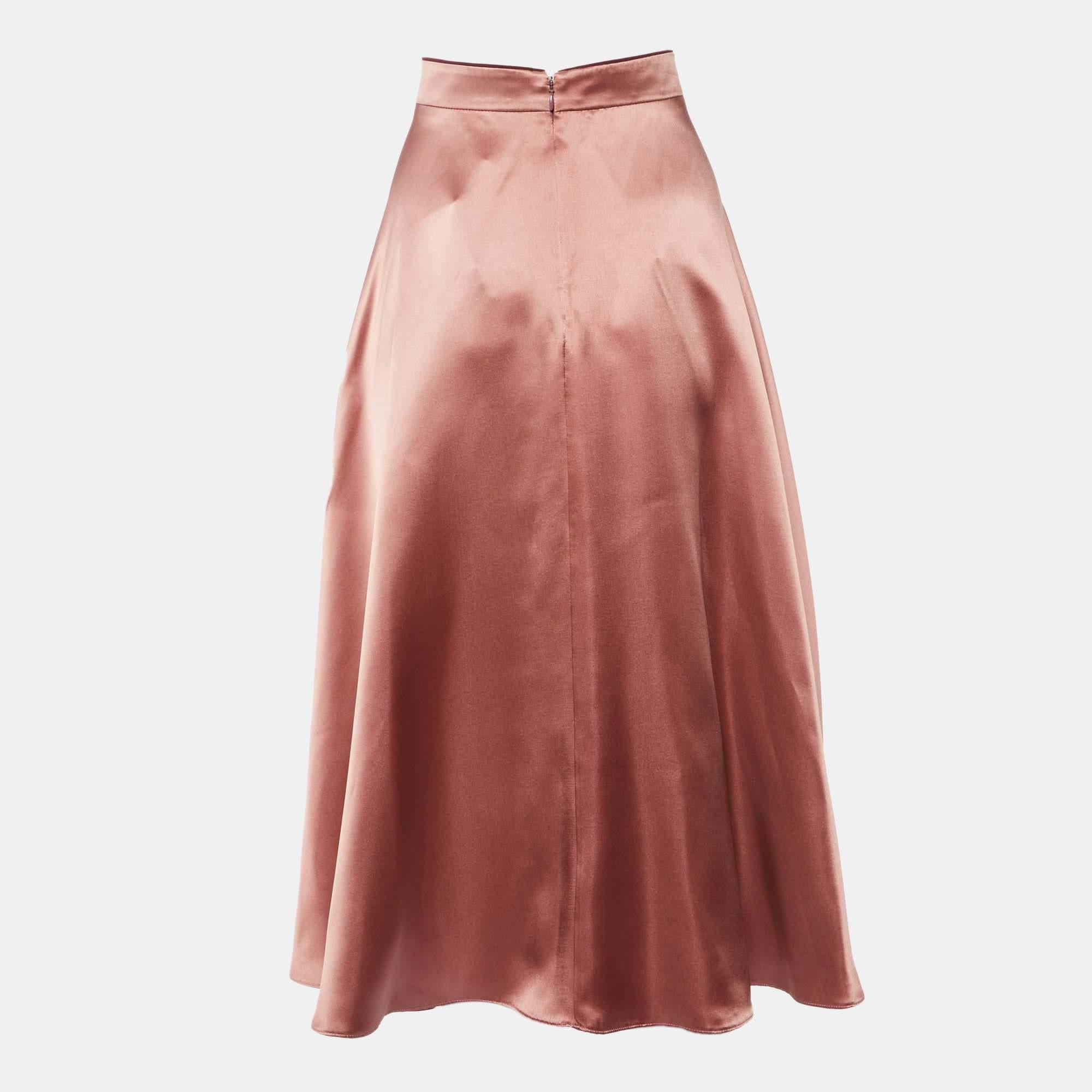 This elegant skirt is worth adding to your closet Crafted from fine materials it is exquisitely designed into a flattering shape.