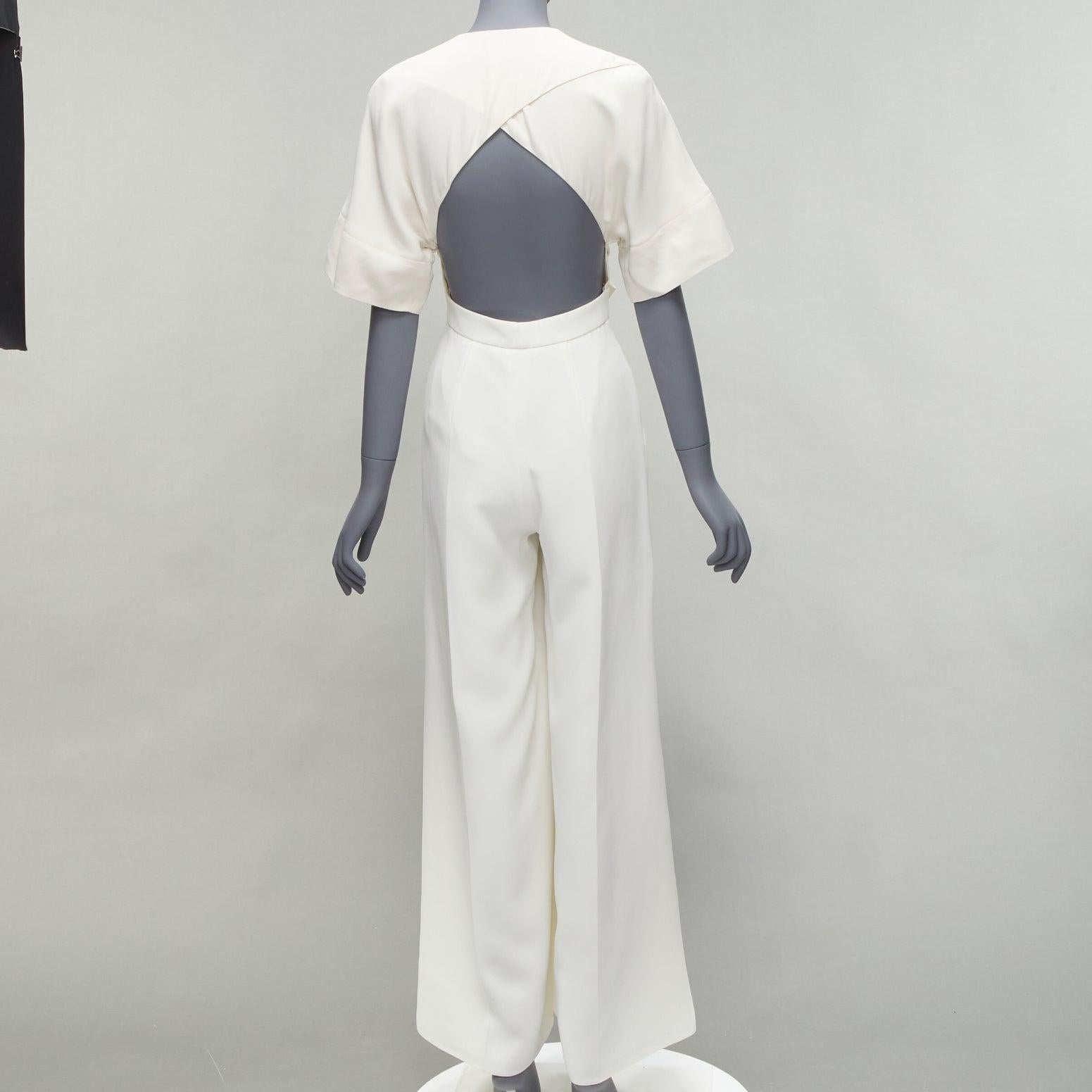 ROKSANDA white backless front tie wide leg jumpsuit UK6 XS
Reference: LNKO/A02166
Brand: Roksanda
Material: Silk, Blend
Color: White
Pattern: Solid
Closure: Zip
Lining: White Silk
Extra Details: Front invisible zip. Backless design.
Made in: