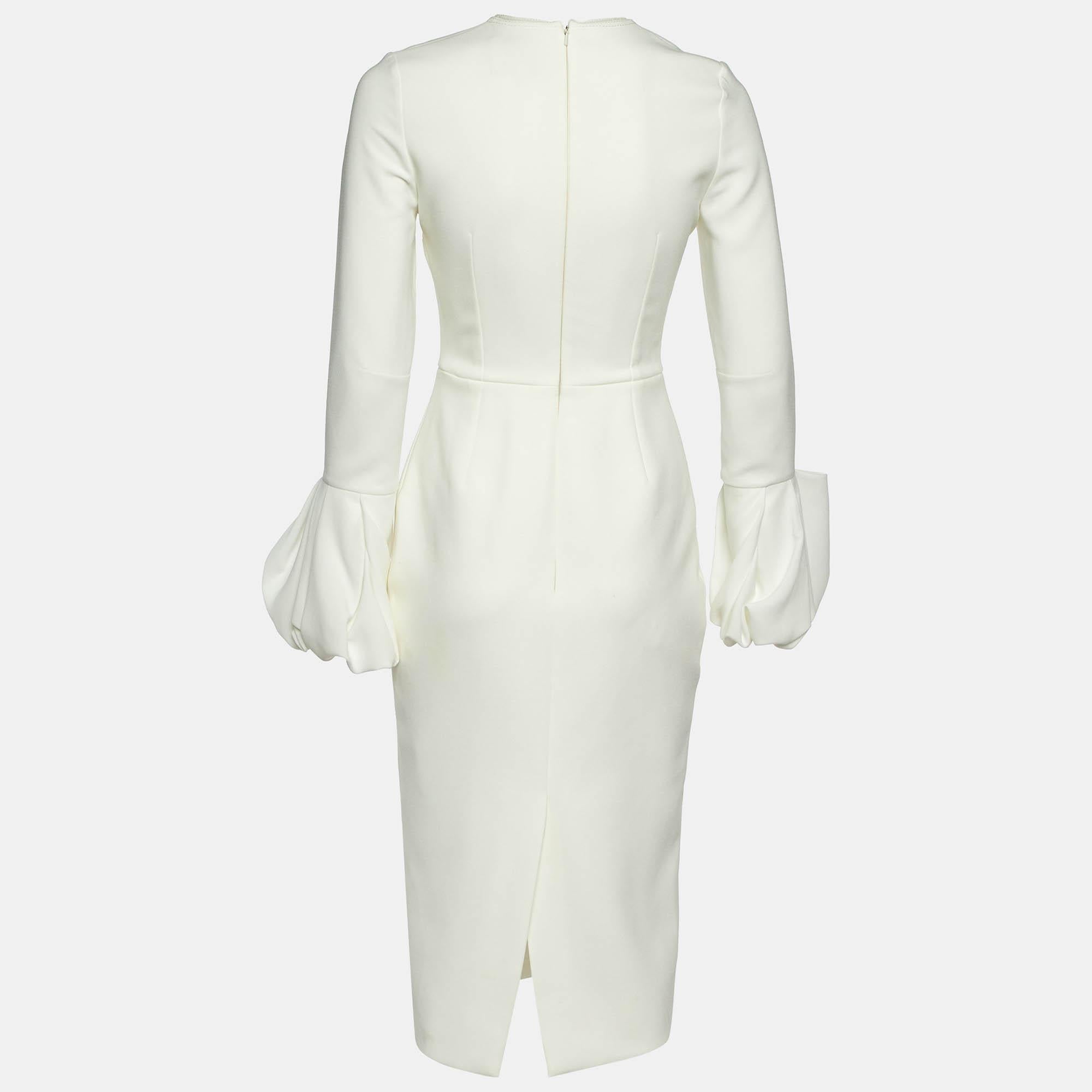Step into timeless elegance with this Roksanda white dress. Meticulously crafted it embodies grace and sophistication making it the perfect choice for those seeking an exquisite wardrobe addition.