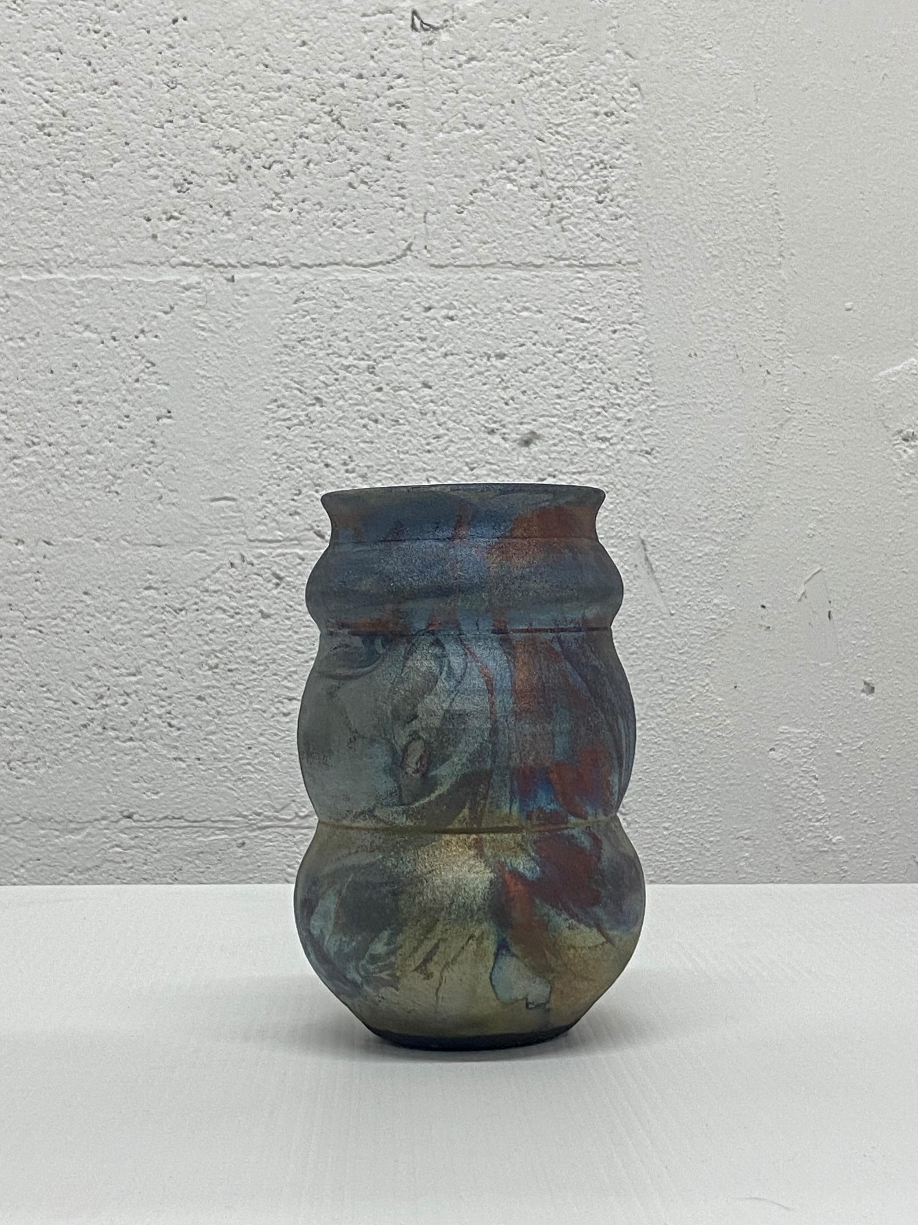 One of a kind ceramic vase fabricated on a turn wheel then fired using the Japanese Roku Technique. Artist signed.