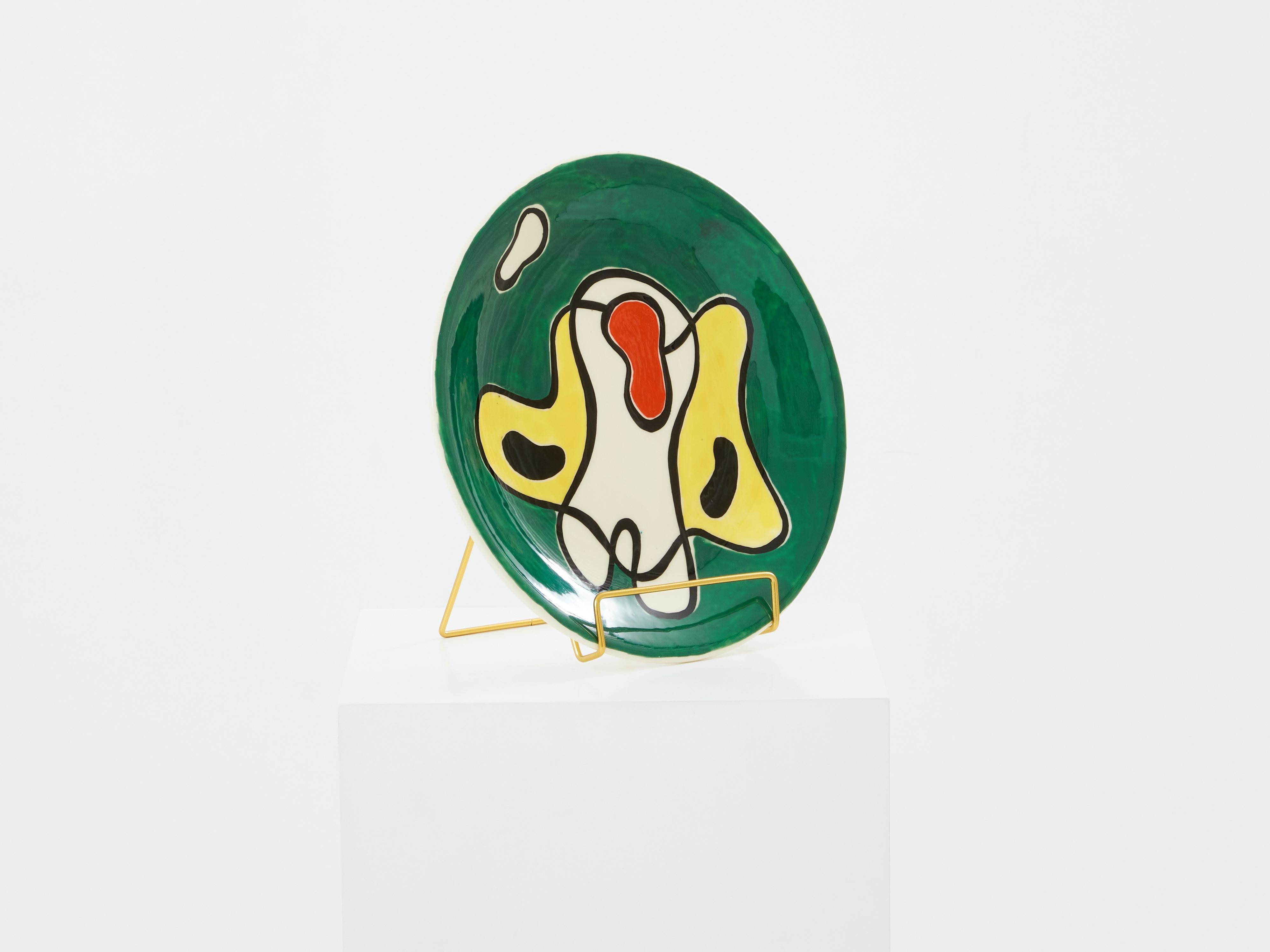 This colourful glazed ceramic round plate was designed and produced by Roland Brice in the 1950s in his workshop in Biot, a small city near Vallauris in the south of France. Roland Brice was the former student of Fernand Léger. He became his close